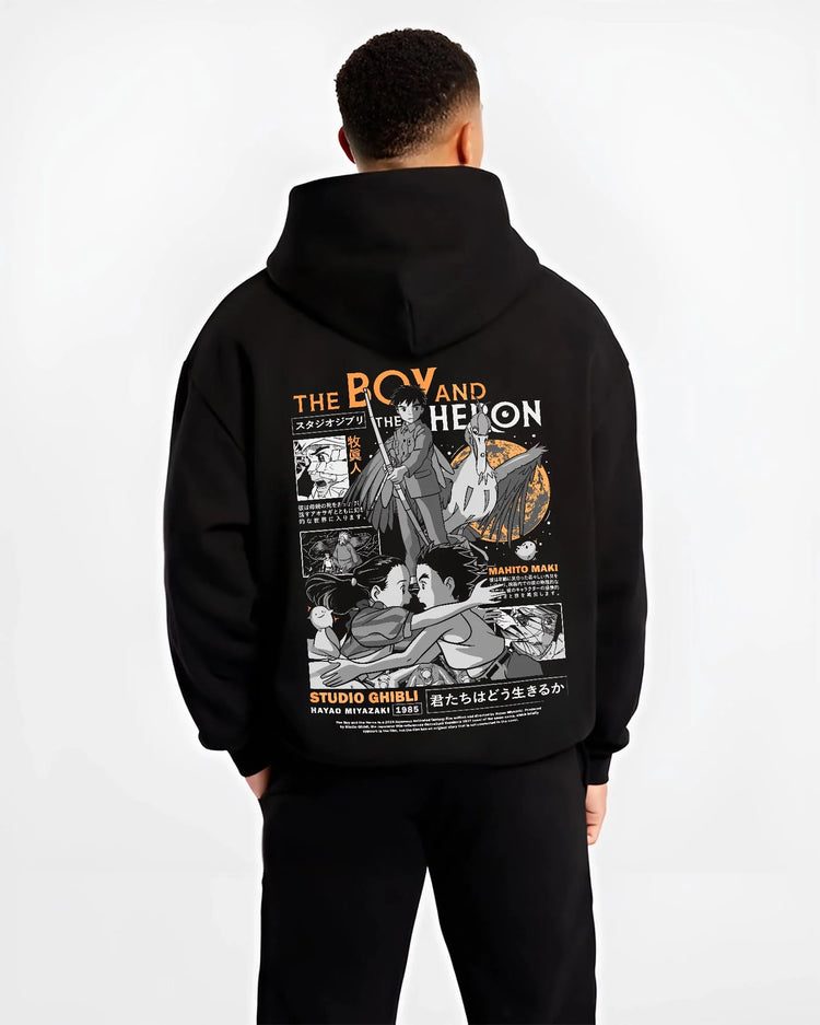 Black hoodie worn by male model, back view with The Boy And The Heron Hoodie Studio Ghibli Cover graphic streetwear graphic.