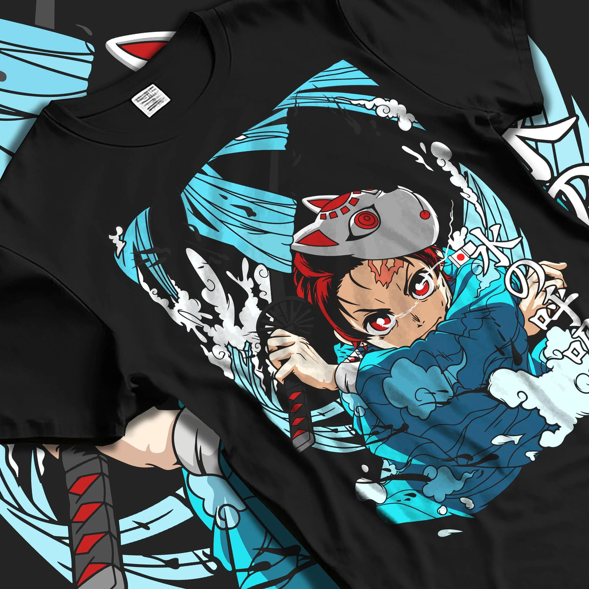 Black T-shirt laid flat with natural folds featuring Tanjiro Hinokami flame and water breathing artwork.