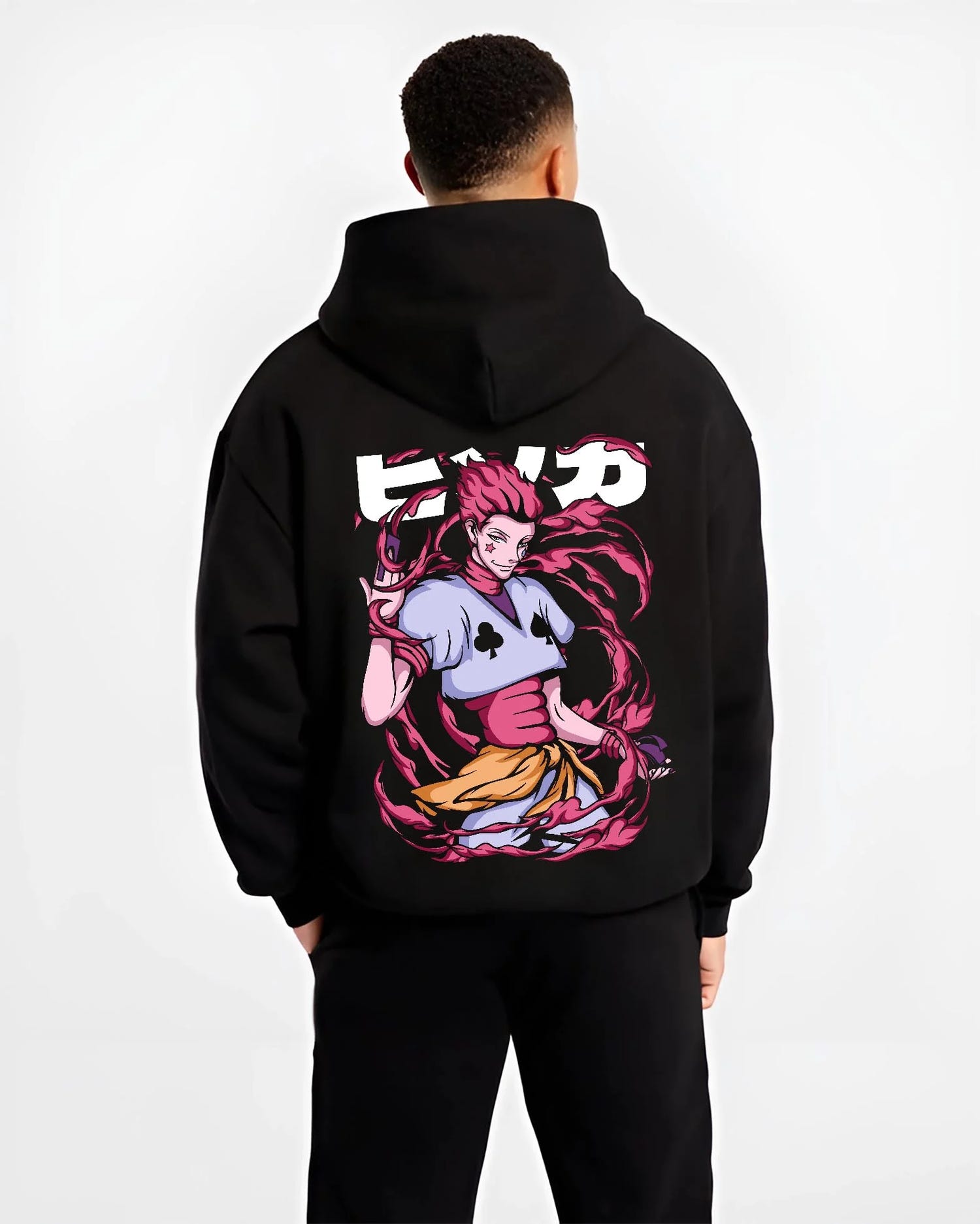 Black hoodie worn by male model, back view with Hunter x Hunter Hoodie Hisoka Deadly Clown Jumper graphic bold anime graphic.