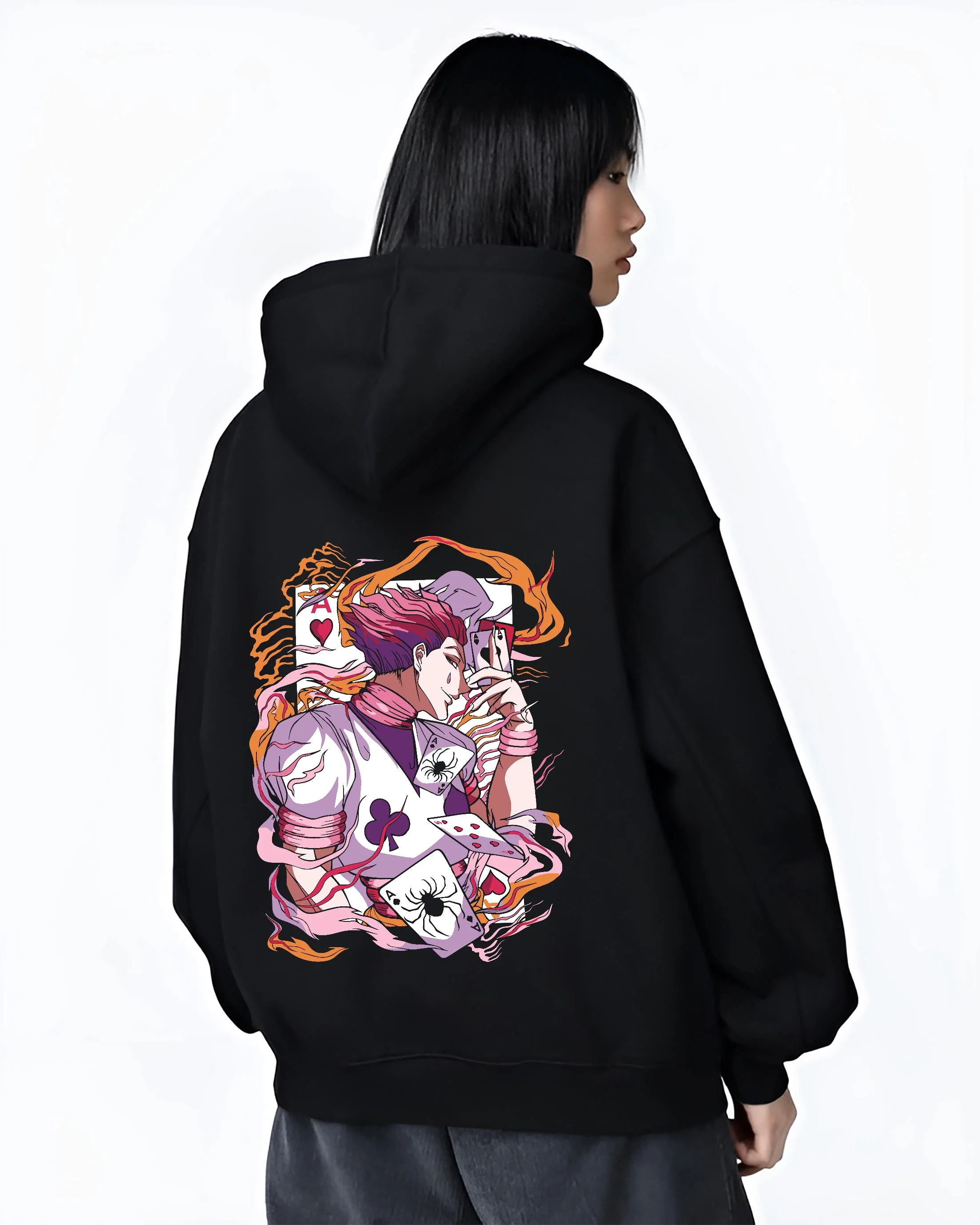 Black hoodie worn by female model, back view with Hunter x Hunter Hoodie Hisoka Joker Playing Card Jumper graphic Hisoka anime design.