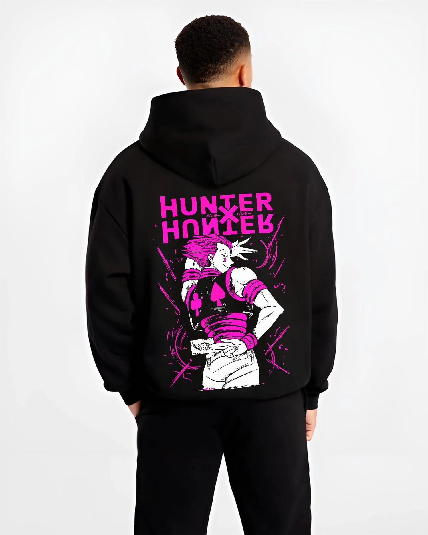 Black hoodie worn by male model, back view with Hunter x Hunter Hoodie Hisoka Menacing Stance Jumper graphic streetwear graphic.