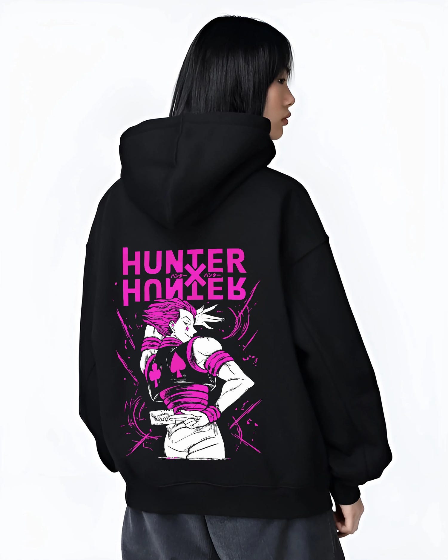 Black hoodie worn by female model, back view with Hunter x Hunter Hoodie Hisoka Menacing Stance Jumper graphic premium wear.