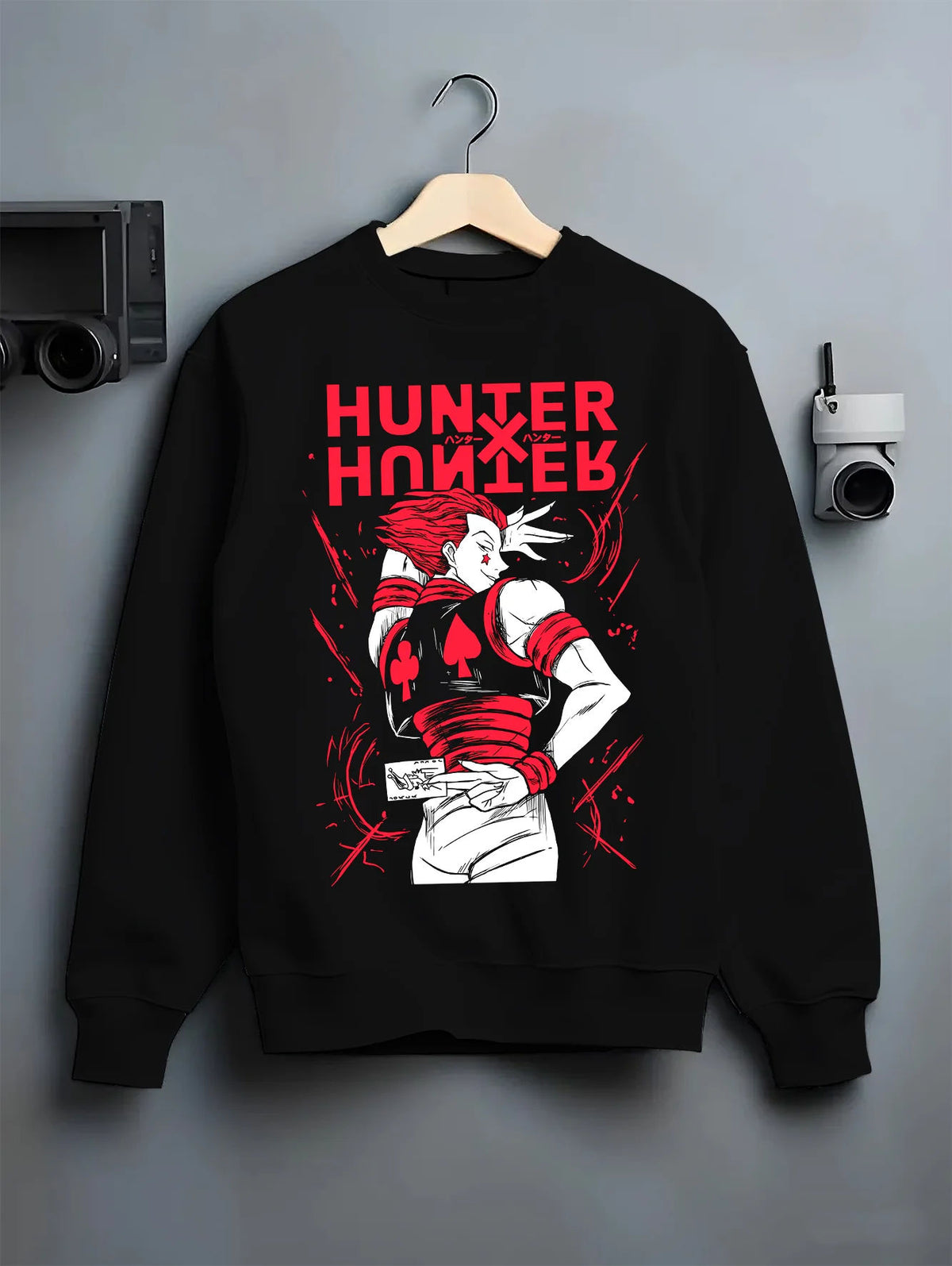 Black crewneck sweatshirt on hanger showing Hisoka Morow from Hunter x Hunter: red-black outfit