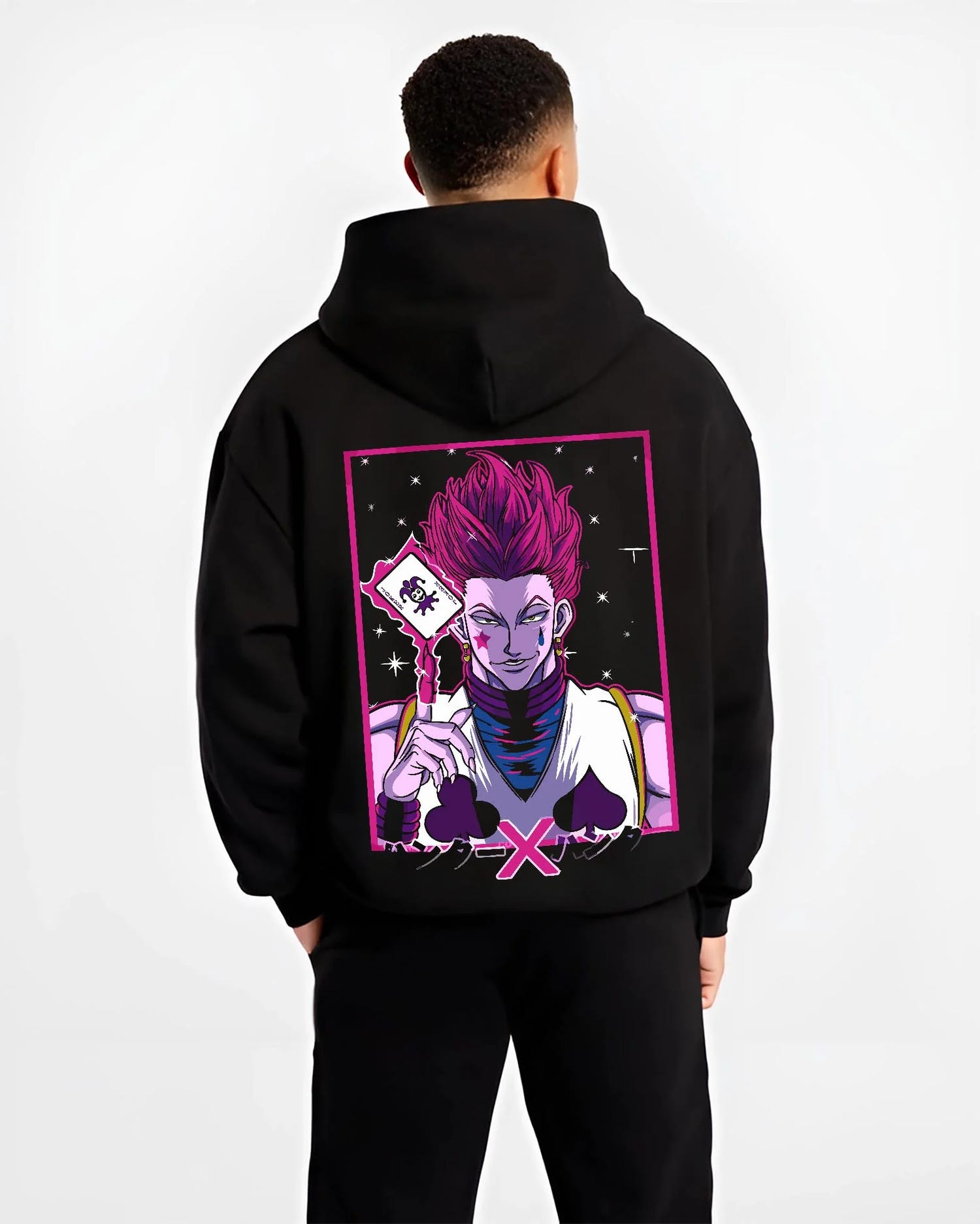Black hoodie worn by male model, back view with Hunter x Hunter Hoodie Hisoka Phantom Troupe Jumper graphic Hisoka anime design.