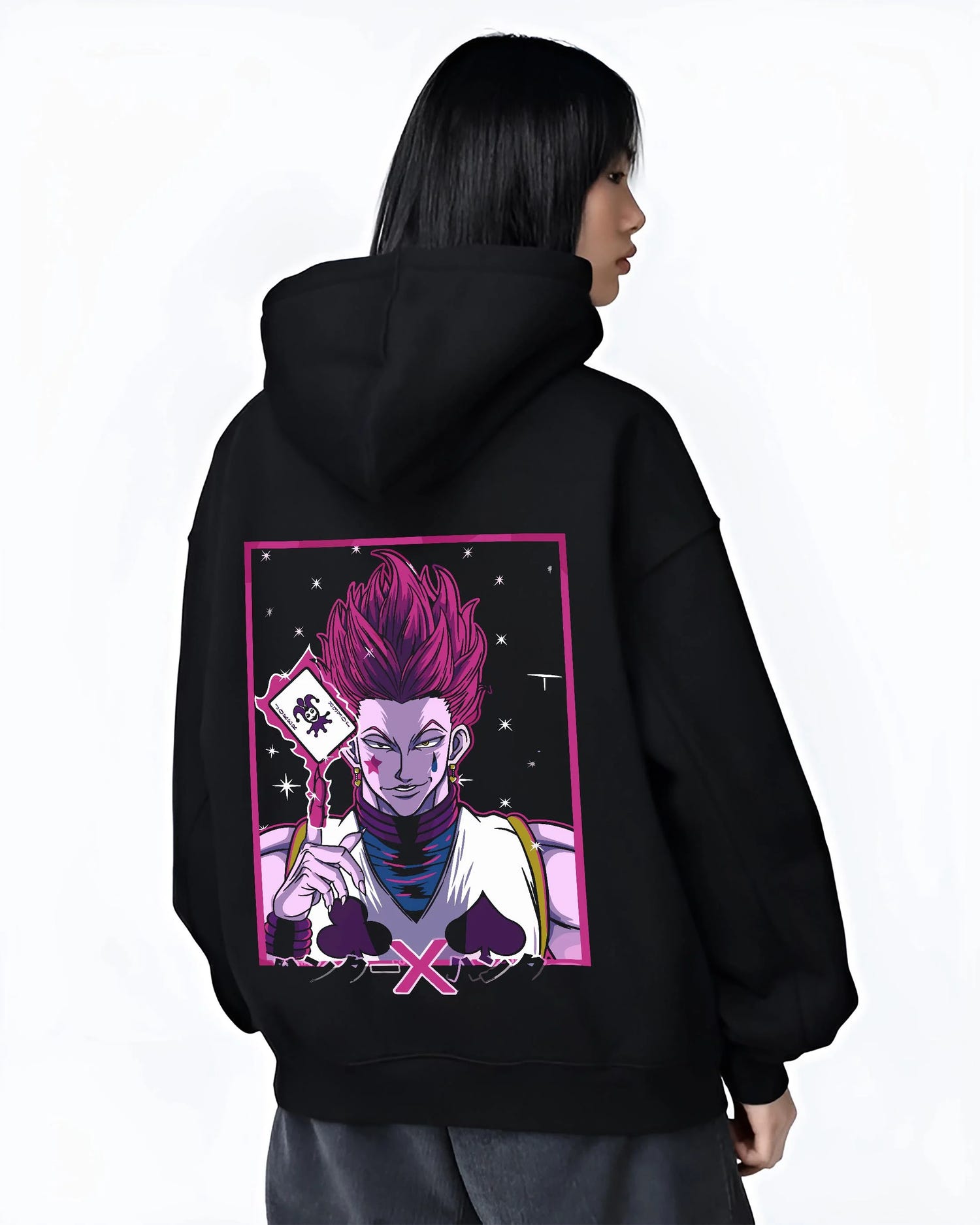 Black hoodie worn by female model, back view with Hunter x Hunter Hoodie Hisoka Phantom Troupe Jumper graphic premium wear.