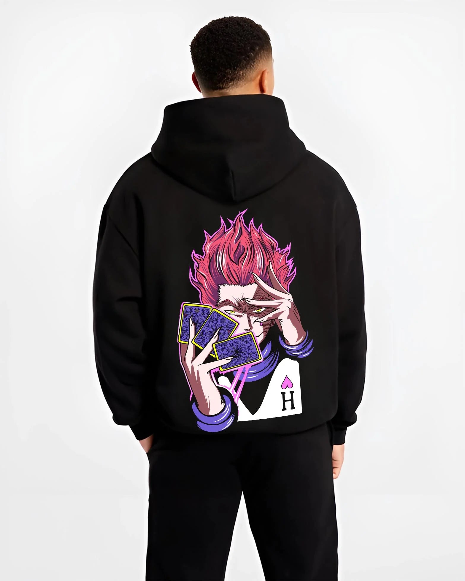 Black hoodie worn by male model, back view with Hunter x Hunter Hoodie Hisoka Twisted Smile Jumper graphic streetwear graphic.