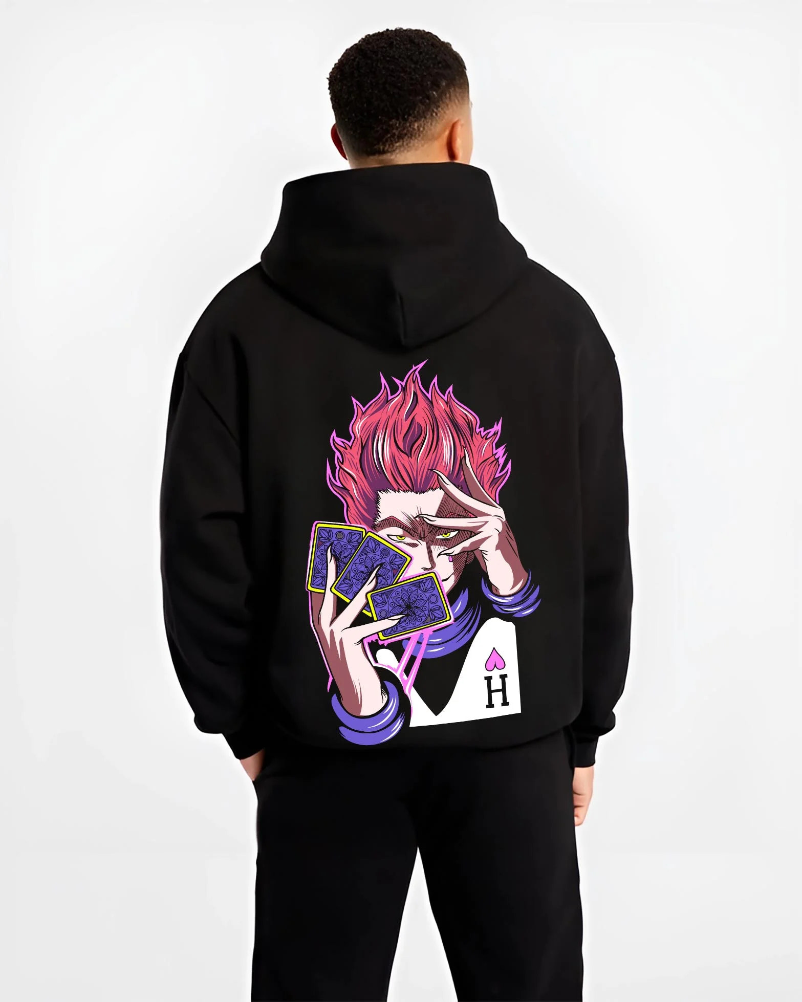 Black hoodie worn by male model, back view with Hunter x Hunter Hoodie Hisoka Twisted Smile Jumper graphic streetwear graphic.