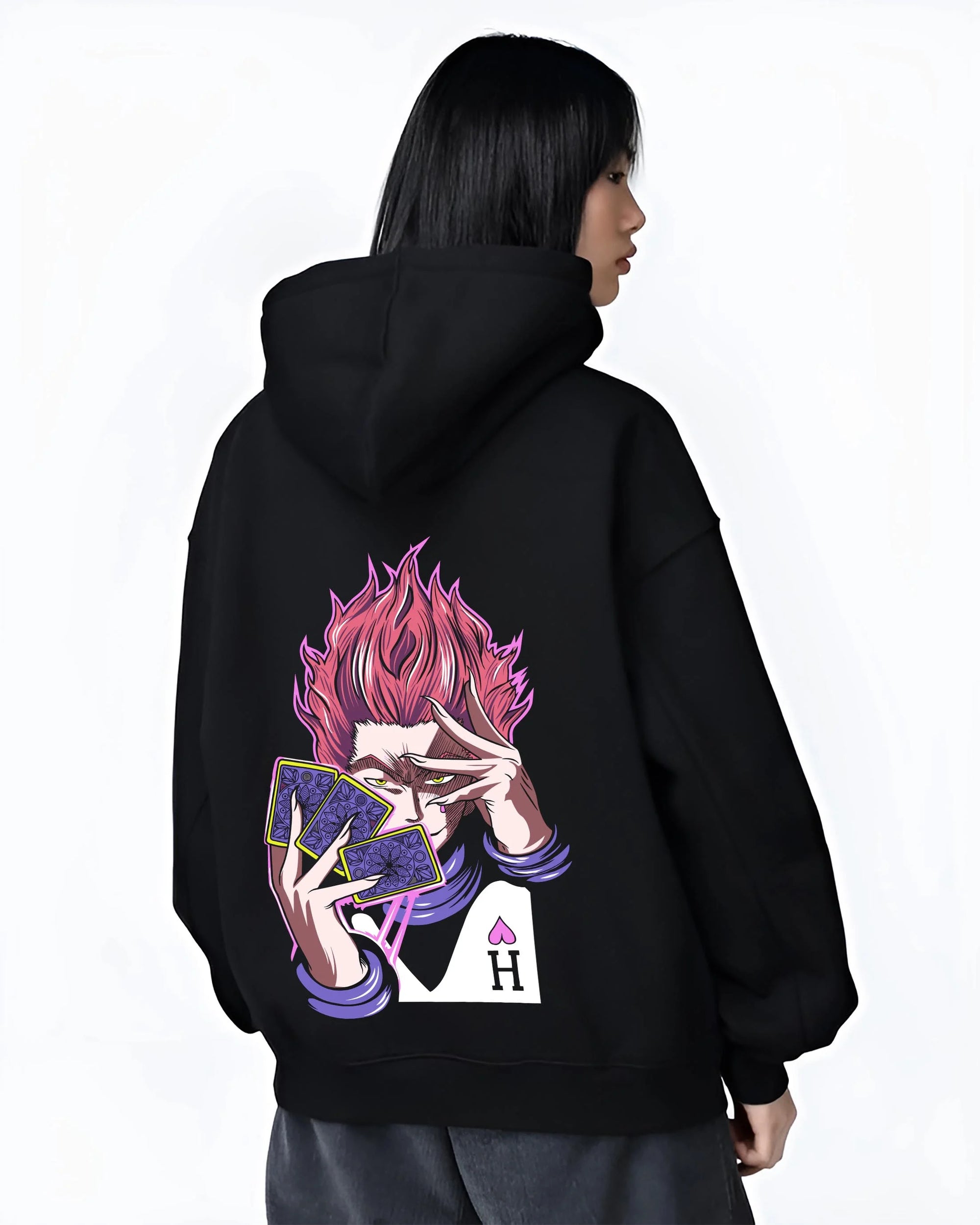 Black hoodie worn by female model, back view with Hunter x Hunter Hoodie Hisoka Twisted Smile Jumper graphic Hisoka anime design.