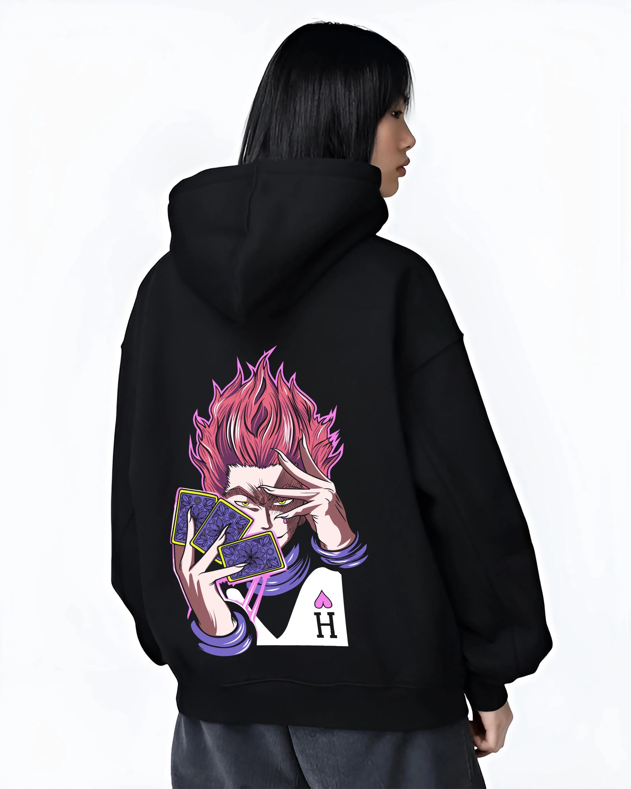 Black hoodie worn by female model, back view with Hunter x Hunter Hoodie Hisoka Twisted Smile Jumper graphic Hisoka anime design.