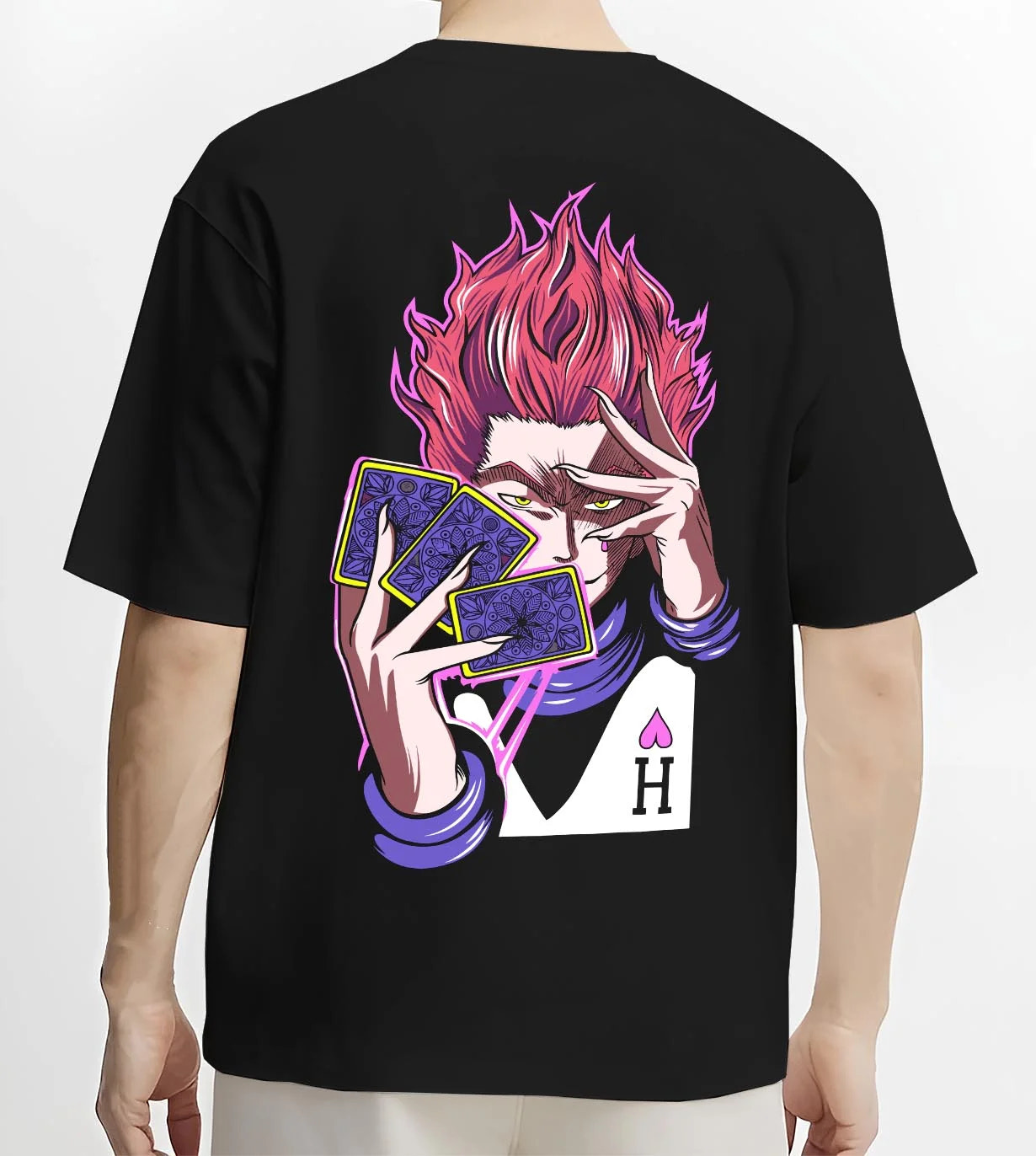 Black T-shirt worn by male model, back view with Hunter x Hunter Hoodie Hisoka Twisted Smile Jumper graphic bold anime graphic.