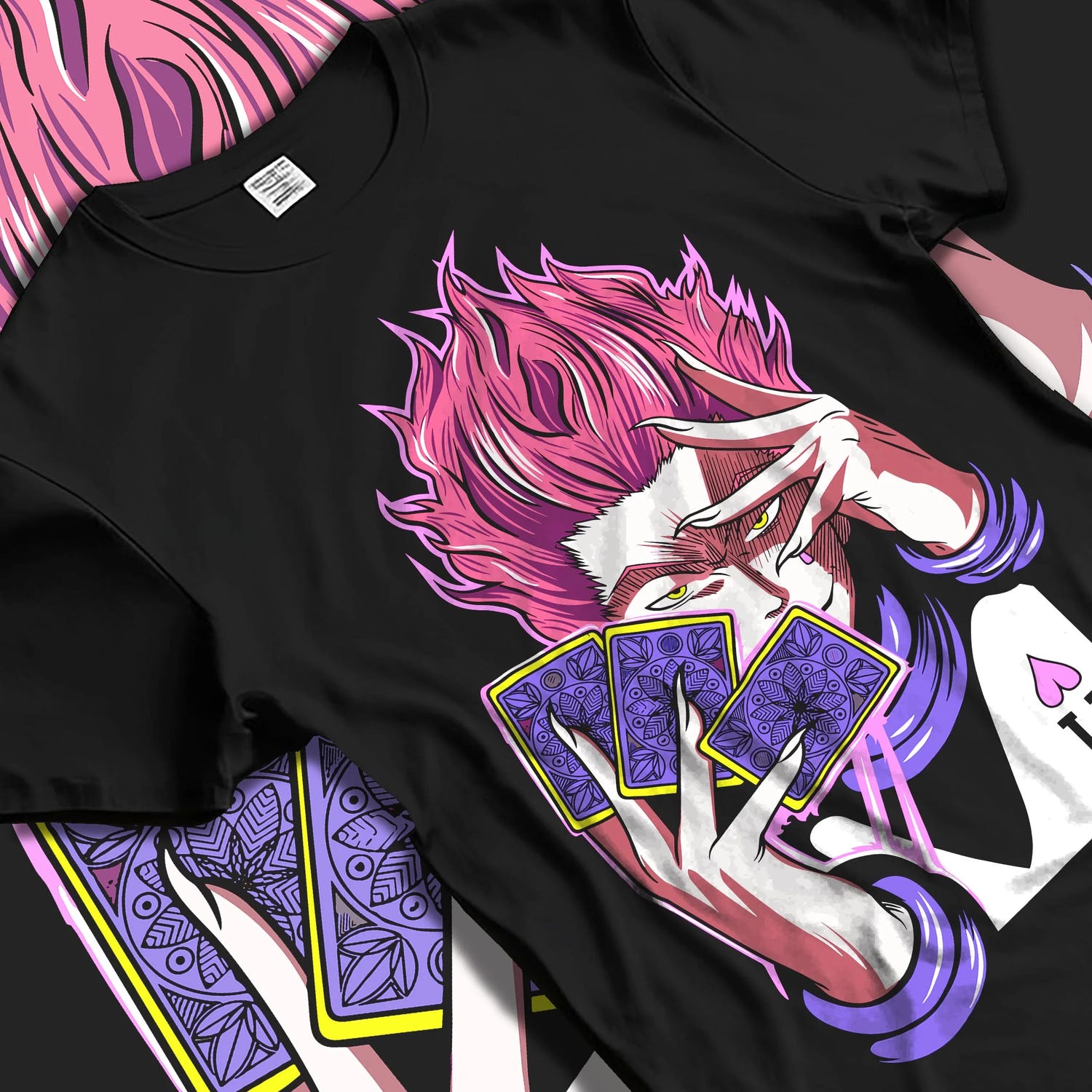 Black T-shirt laid flat with natural folds with Hunter x Hunter Hoodie Hisoka Twisted Smile Jumper graphic streetwear graphic.