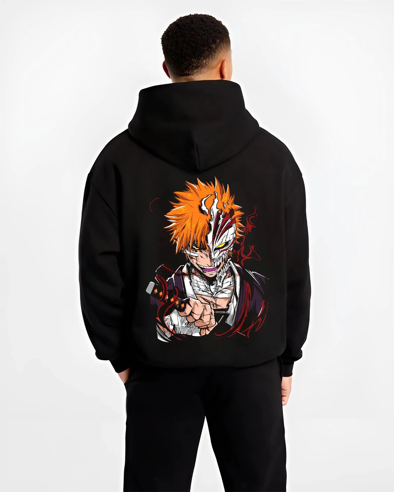 Black hoodie worn by male model, back view with Ichigo Hollow Mask Hoodie Bleach Vizard Form Battle graphic streetwear graphic.