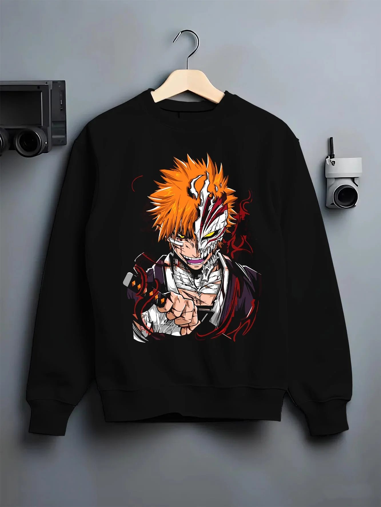 Black crewneck sweatshirt on hanger with Ichigo Hollow Mask Hoodie Bleach Vizard Form Battle graphic bold anime graphic.