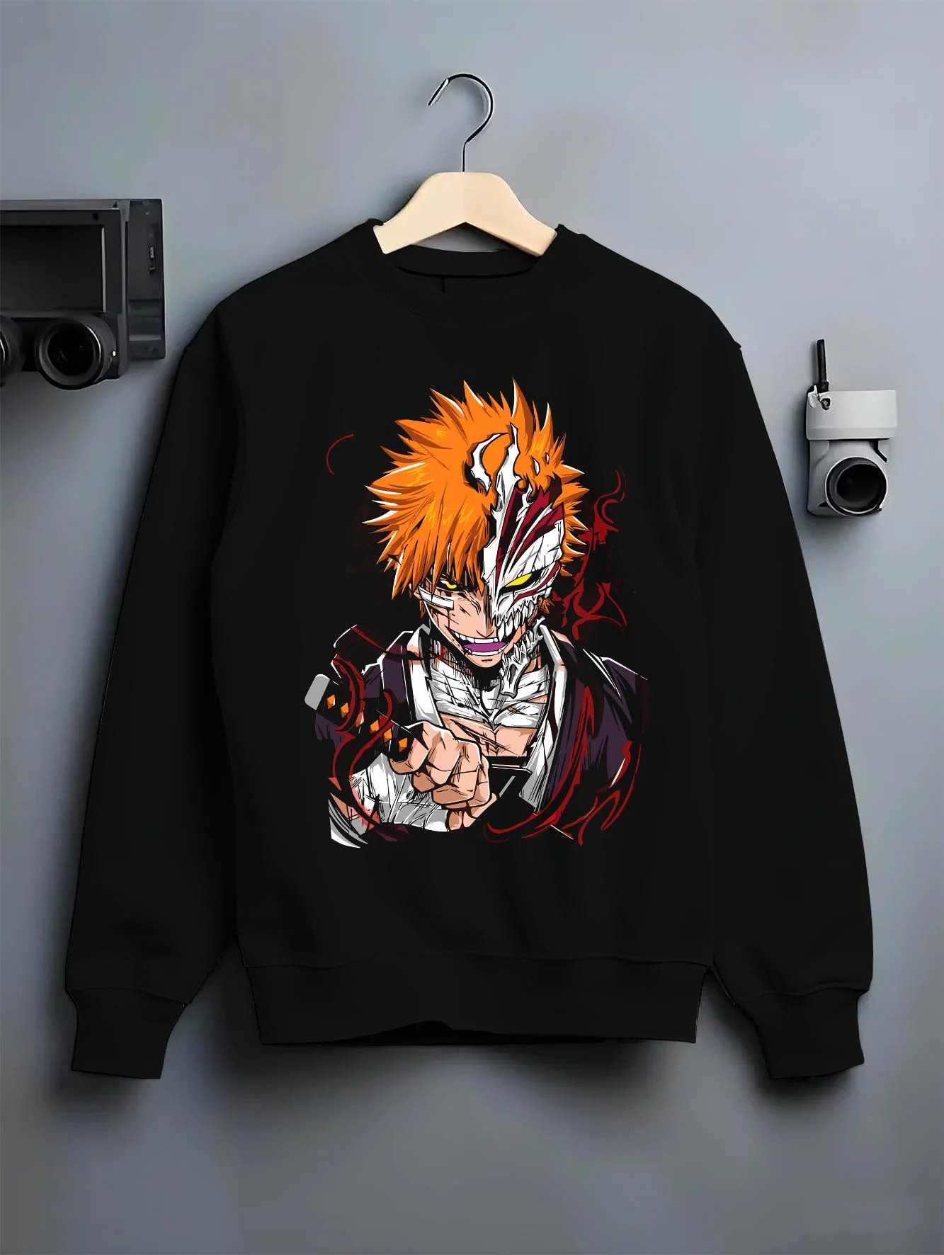 Black crewneck sweatshirt on hanger with Ichigo Hollow Mask Hoodie Bleach Vizard Form Battle graphic bold anime graphic.