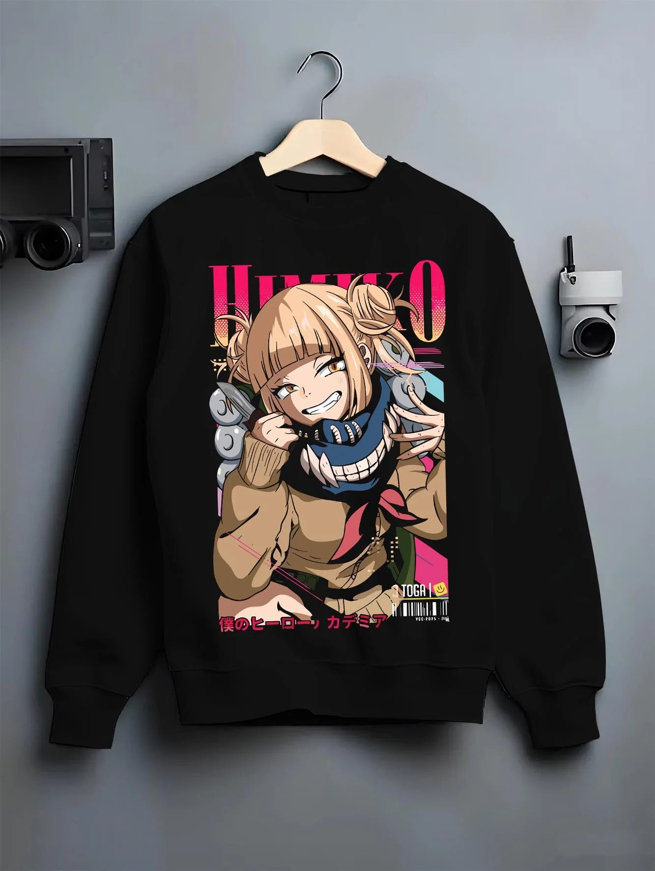 Black crewneck sweatshirt on hanger with My Hero Academia Hoodie Himiko Toga Quirk Jumper graphic bold anime graphic.