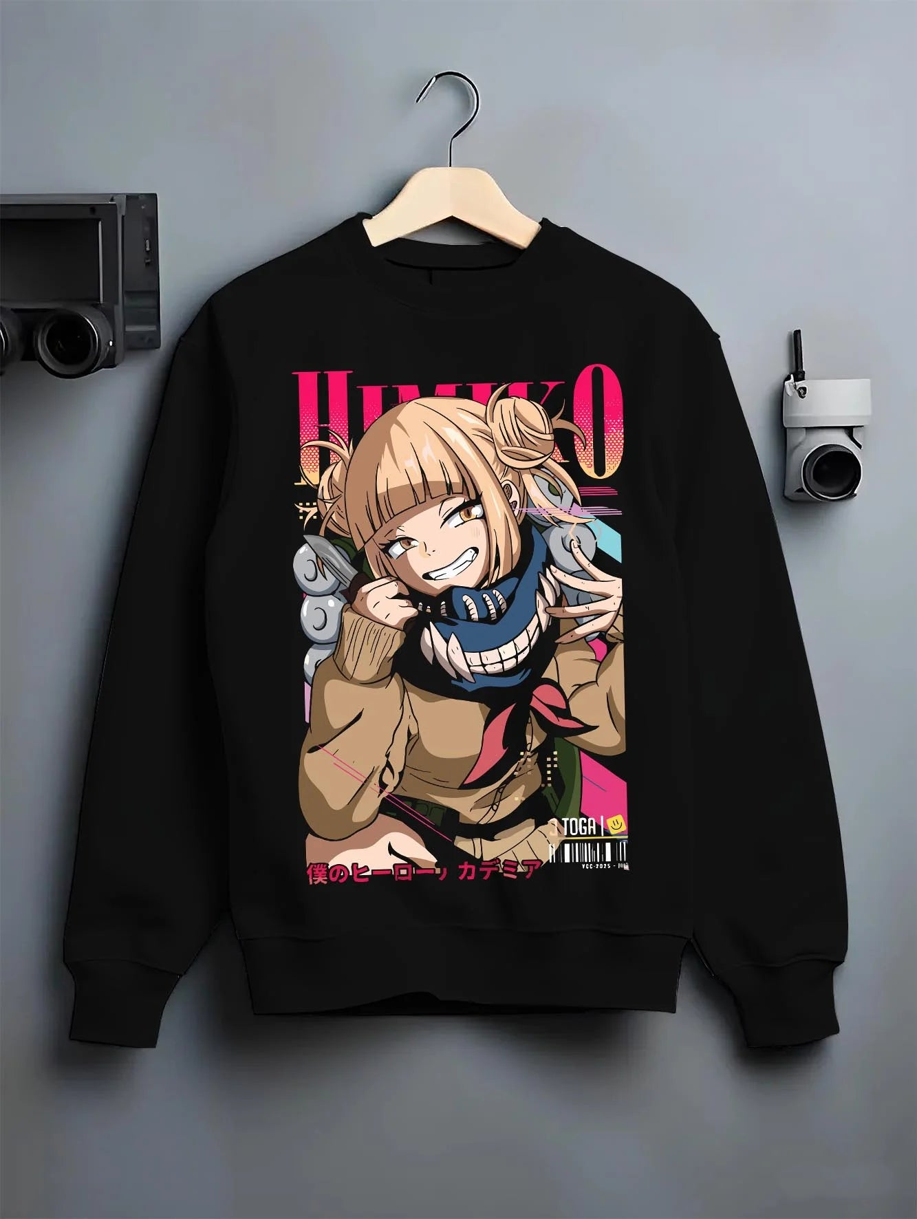 Black crewneck sweatshirt on hanger with My Hero Academia Hoodie Himiko Toga Quirk Jumper graphic bold anime graphic.