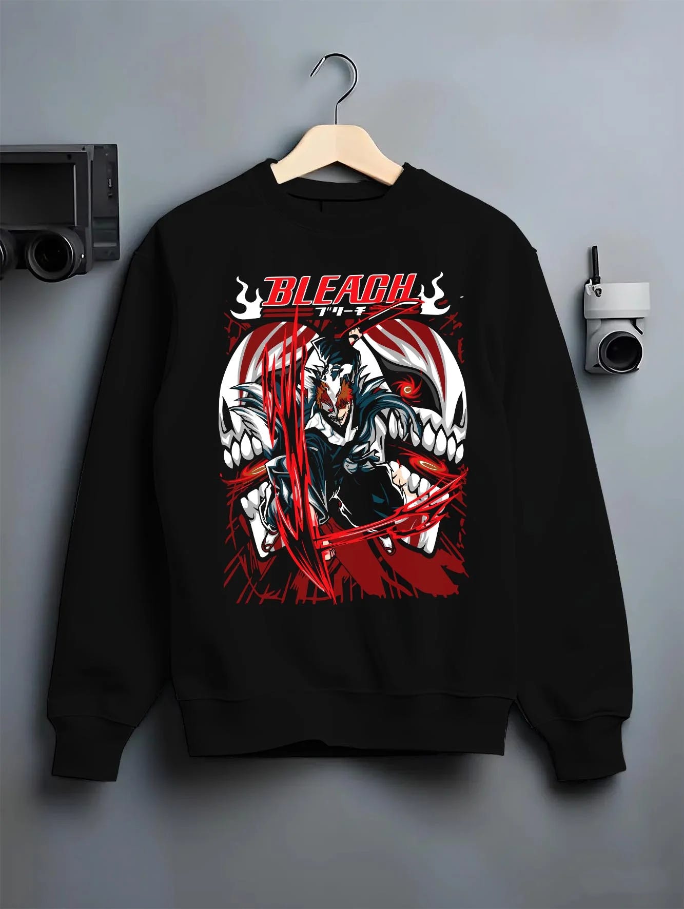 Black crewneck sweatshirt on hanger with Ichigo Hollow Form Hoodie Bleach Inner Hollow Rage graphic bold anime graphic.