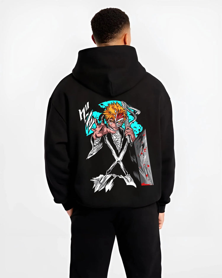 Black hoodie worn by male model, back view with Ichigo Hollow Mask Hoodie Bleach Anime Warrior Jumper graphic bold anime graphic.