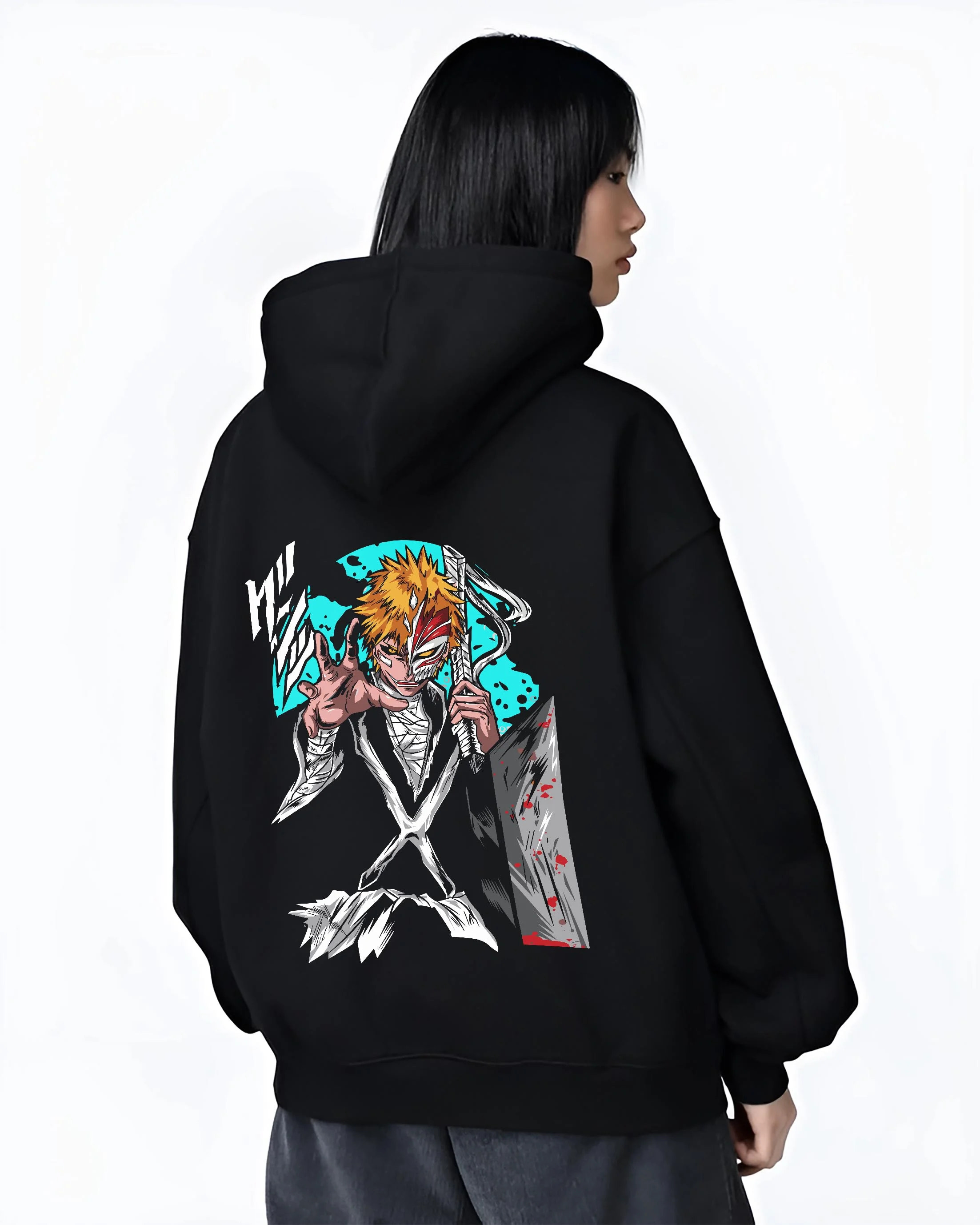 Black hoodie worn by female model, back view with Ichigo Hollow Mask Hoodie Bleach Anime Warrior Jumper graphic bold anime graphic.