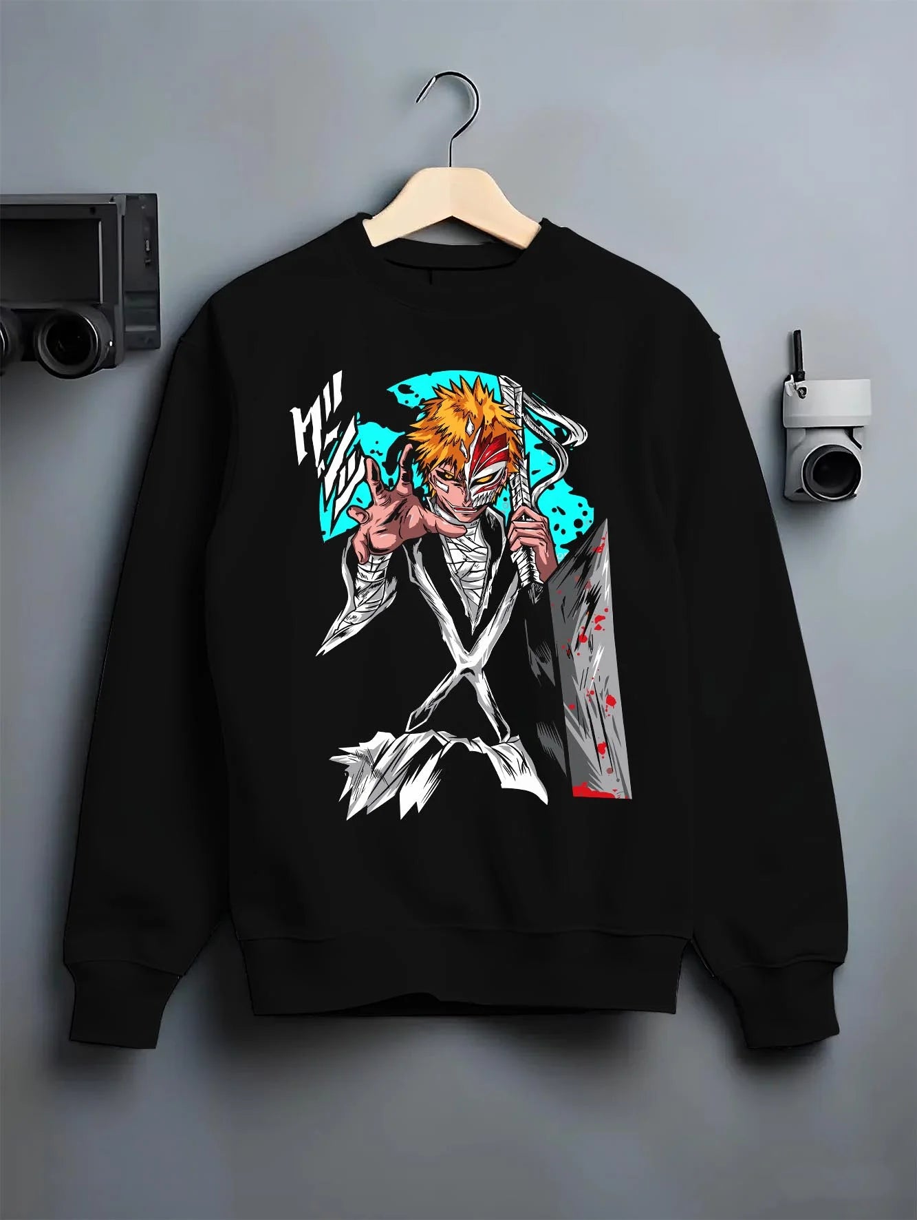 Black crewneck sweatshirt on hanger with Ichigo Hollow Mask Hoodie Bleach Anime Warrior Jumper graphic streetwear graphic.