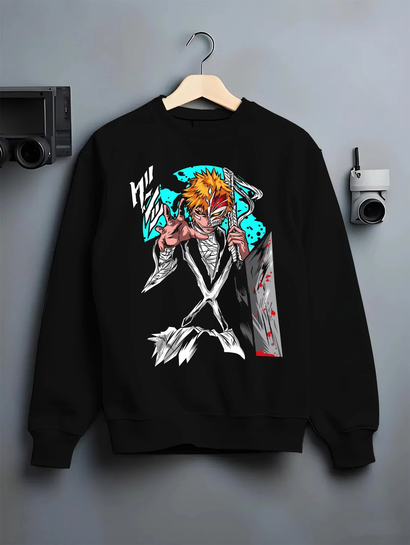 Black crewneck sweatshirt on hanger with Ichigo Hollow Mask Hoodie Bleach Anime Warrior Jumper graphic streetwear graphic.