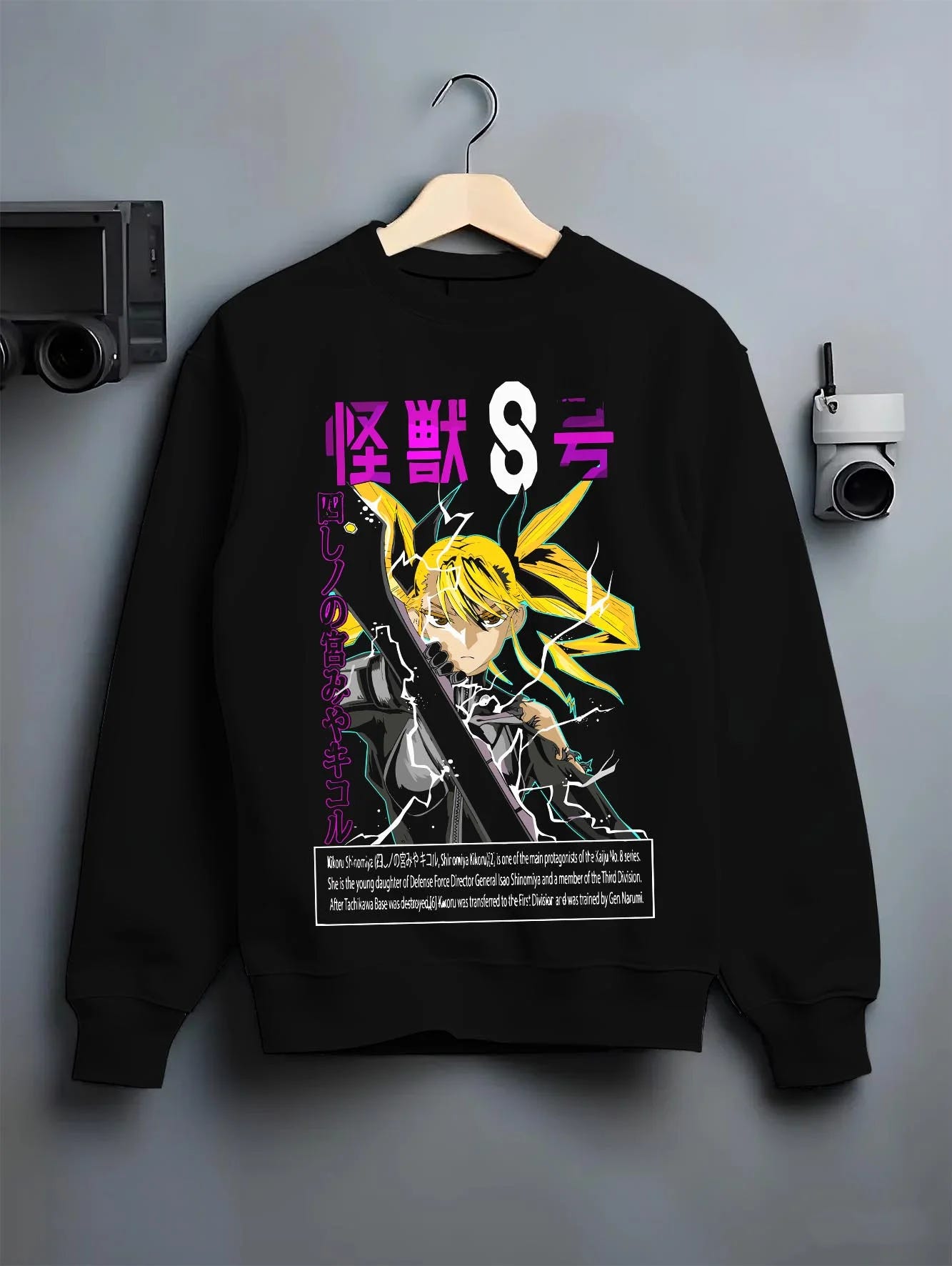 Black crewneck sweatshirt on hanger with Kaiju No. 8 Hoodie Shin Monster Defence Jumper graphic bold anime graphic.