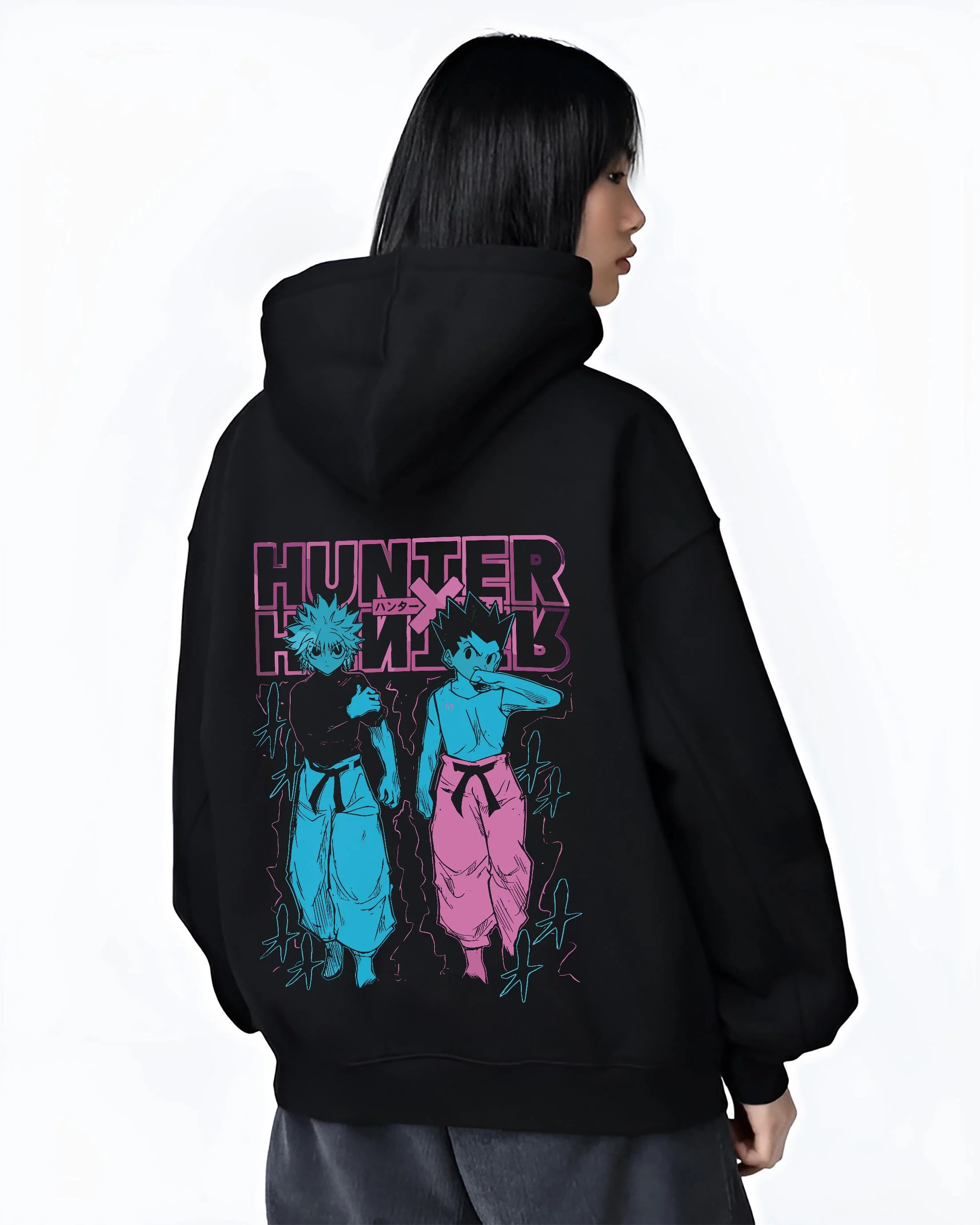 Black hoodie worn by female model, back view with Hunter x Hunter Hoodie Gon Killua Duo Jumper graphic bold anime graphic.