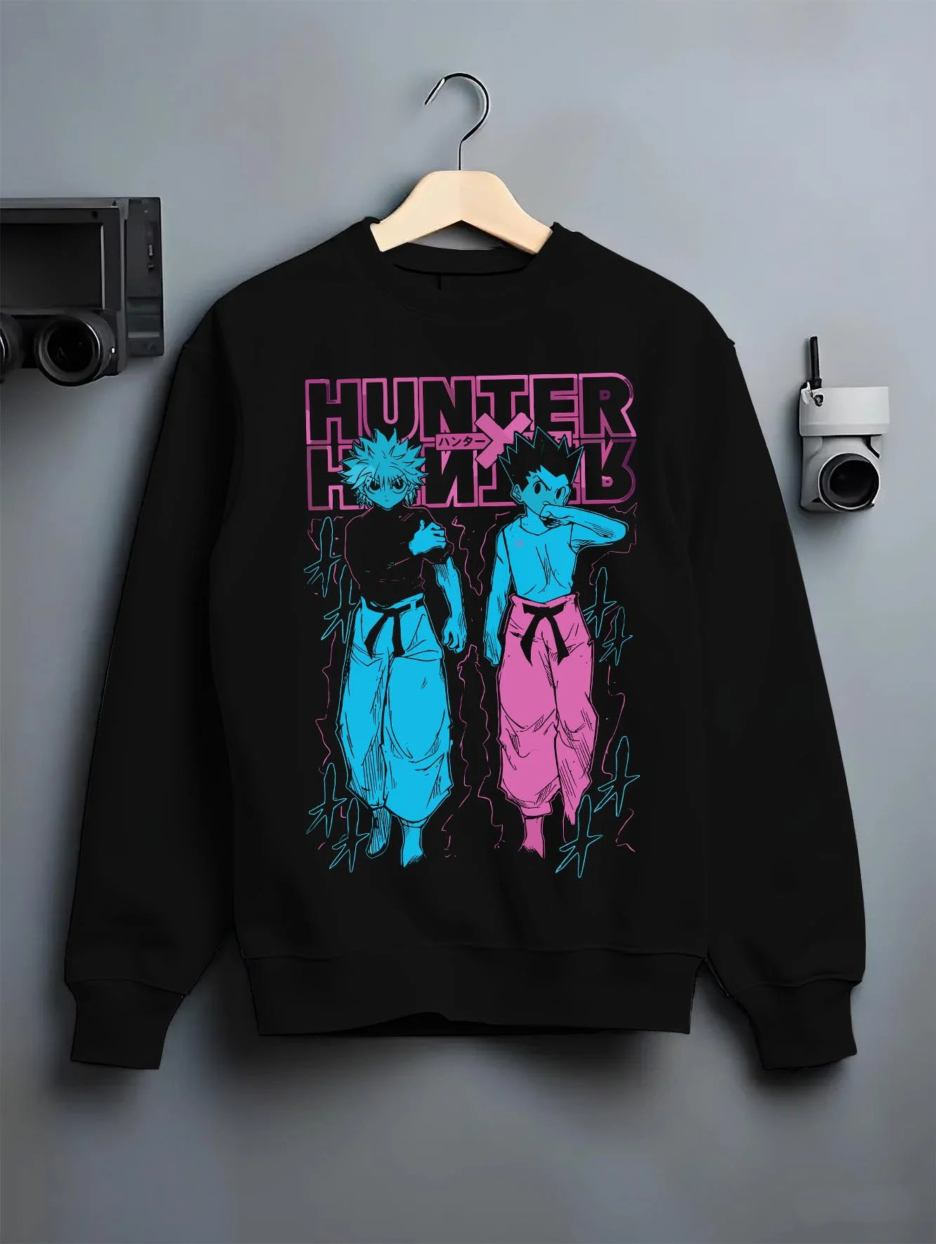 Black crewneck sweatshirt on hanger with Hunter x Hunter Hoodie Gon Killua Duo Jumper graphic premium wear.