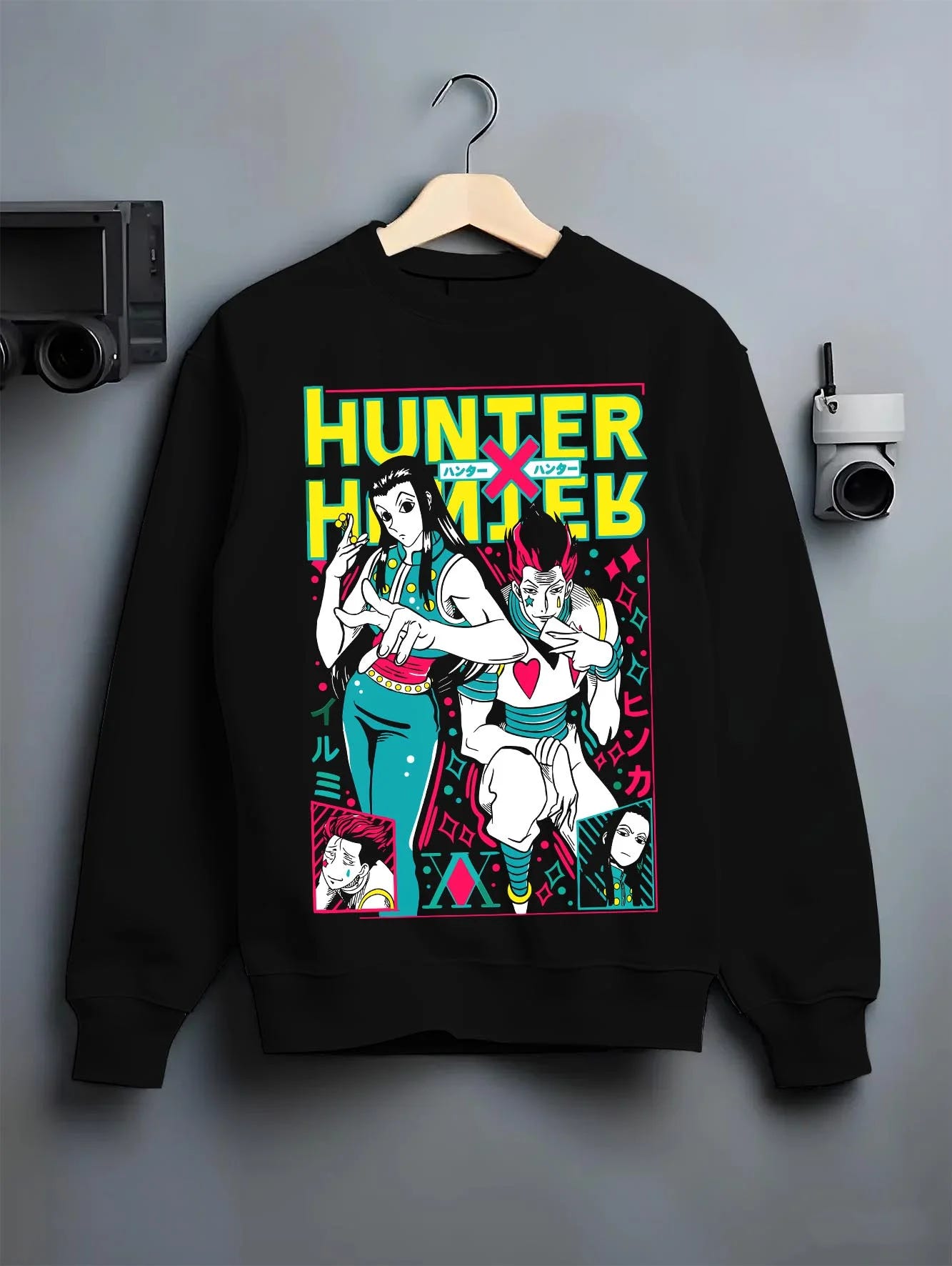 Black crewneck sweatshirt on hanger with Hunter x Hunter Hoodie Phantom Troupe Group Jumper graphic bold anime graphic.