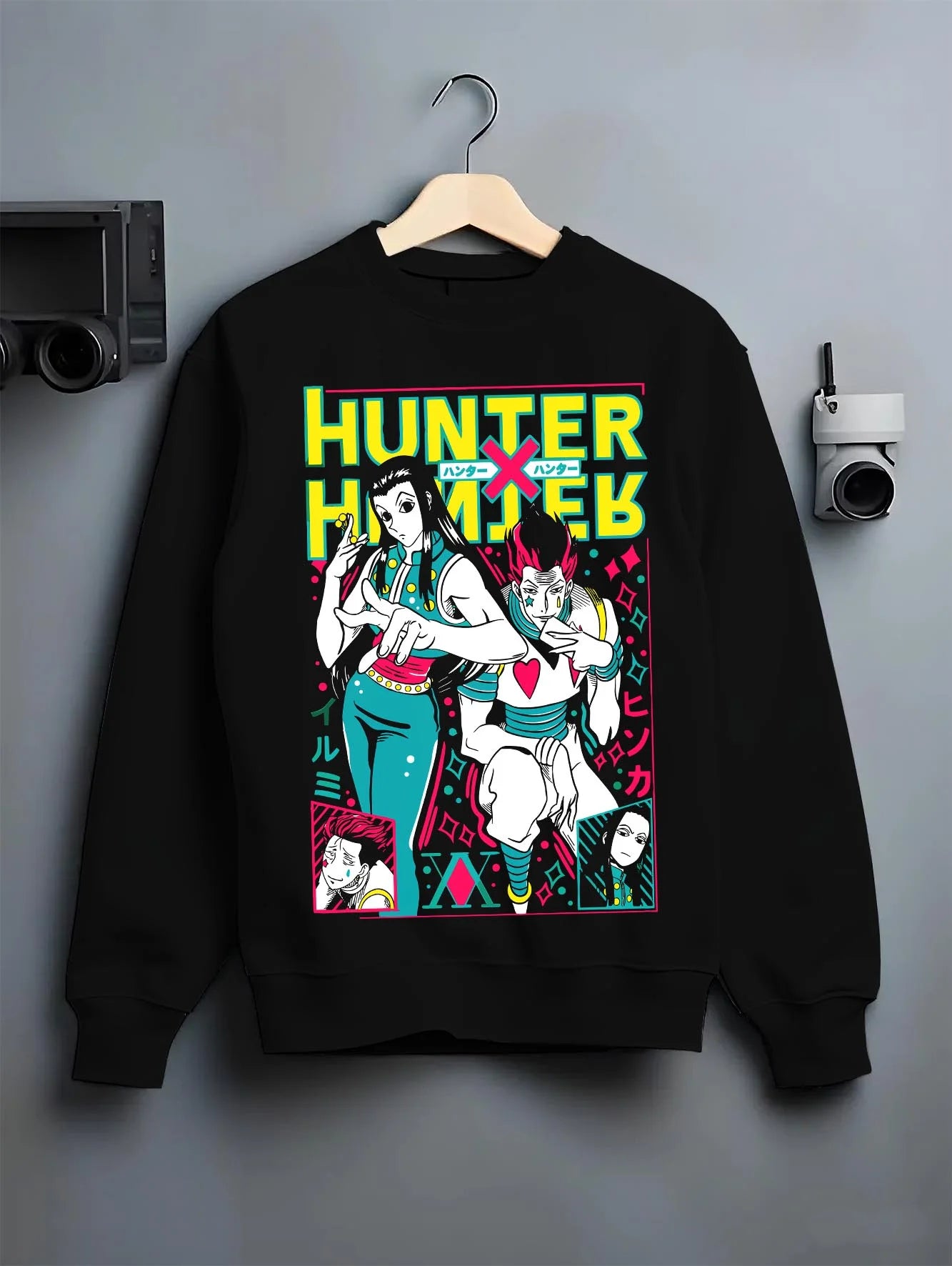 Black crewneck sweatshirt on hanger with Hunter x Hunter Hoodie Phantom Troupe Group Jumper graphic bold anime graphic.