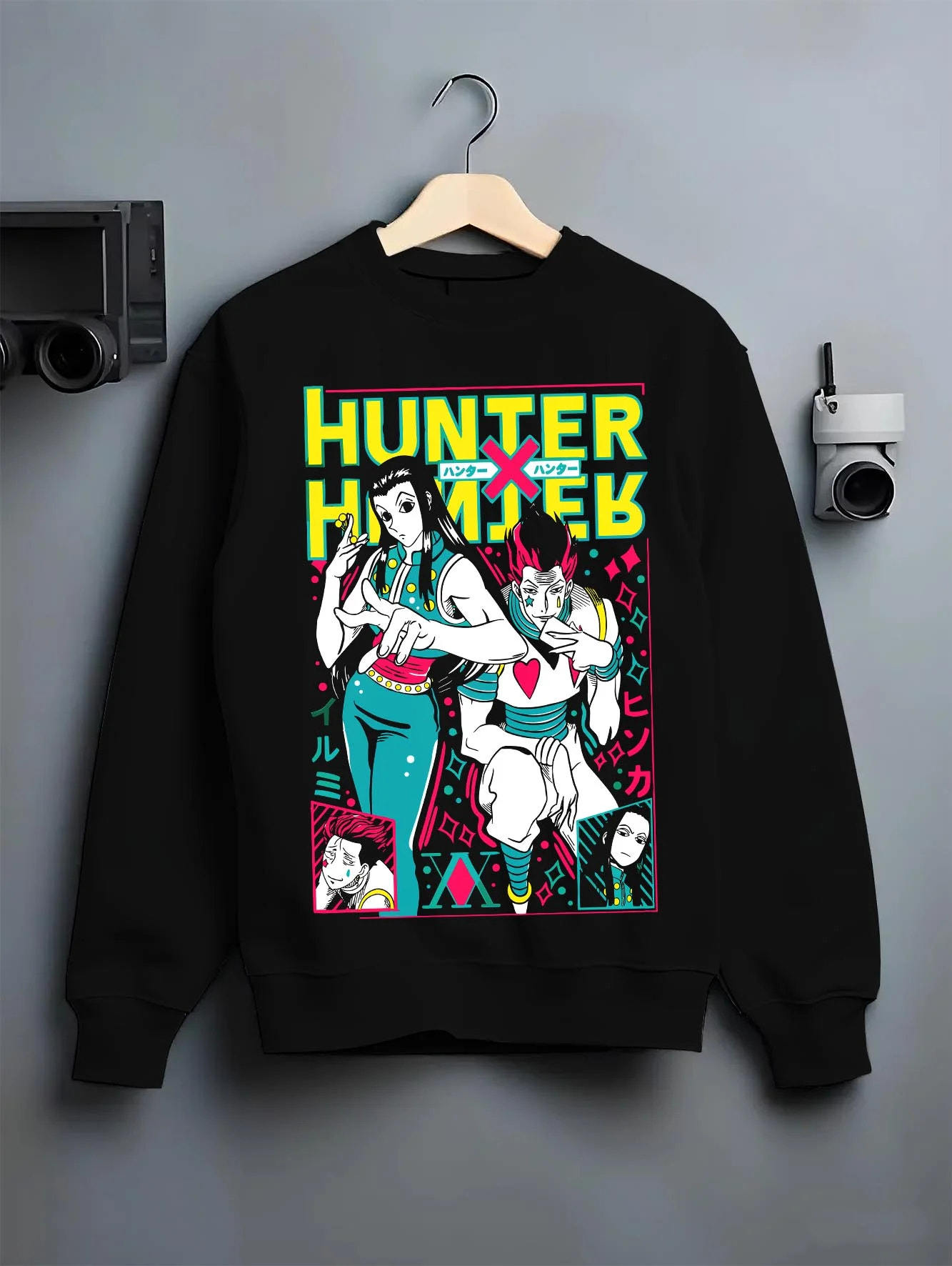 Black crewneck sweatshirt on hanger with Hunter x Hunter Hoodie Phantom Troupe Group Jumper graphic bold anime graphic.