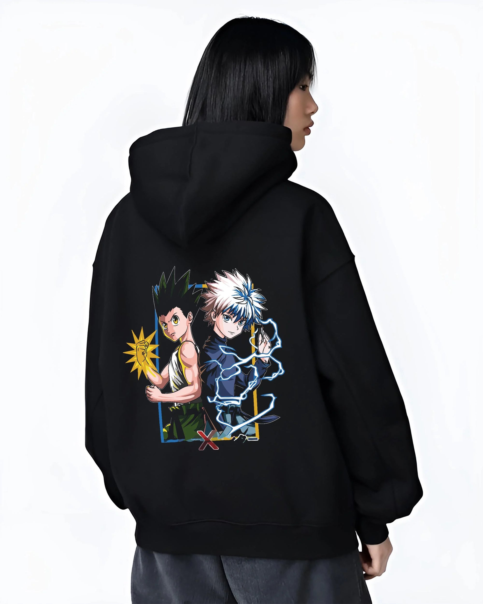 Black hoodie worn by female model, back view with Hunter x Hunter Hoodie Gon Freecss Determined Jumper graphic streetwear graphic.