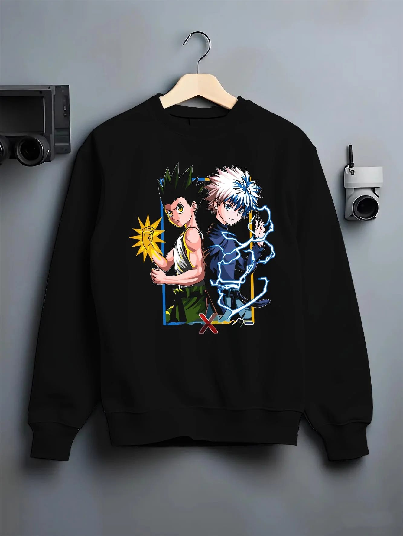 Black crewneck sweatshirt on hanger with Hunter x Hunter Hoodie Gon Freecss Determined Jumper graphic premium wear.