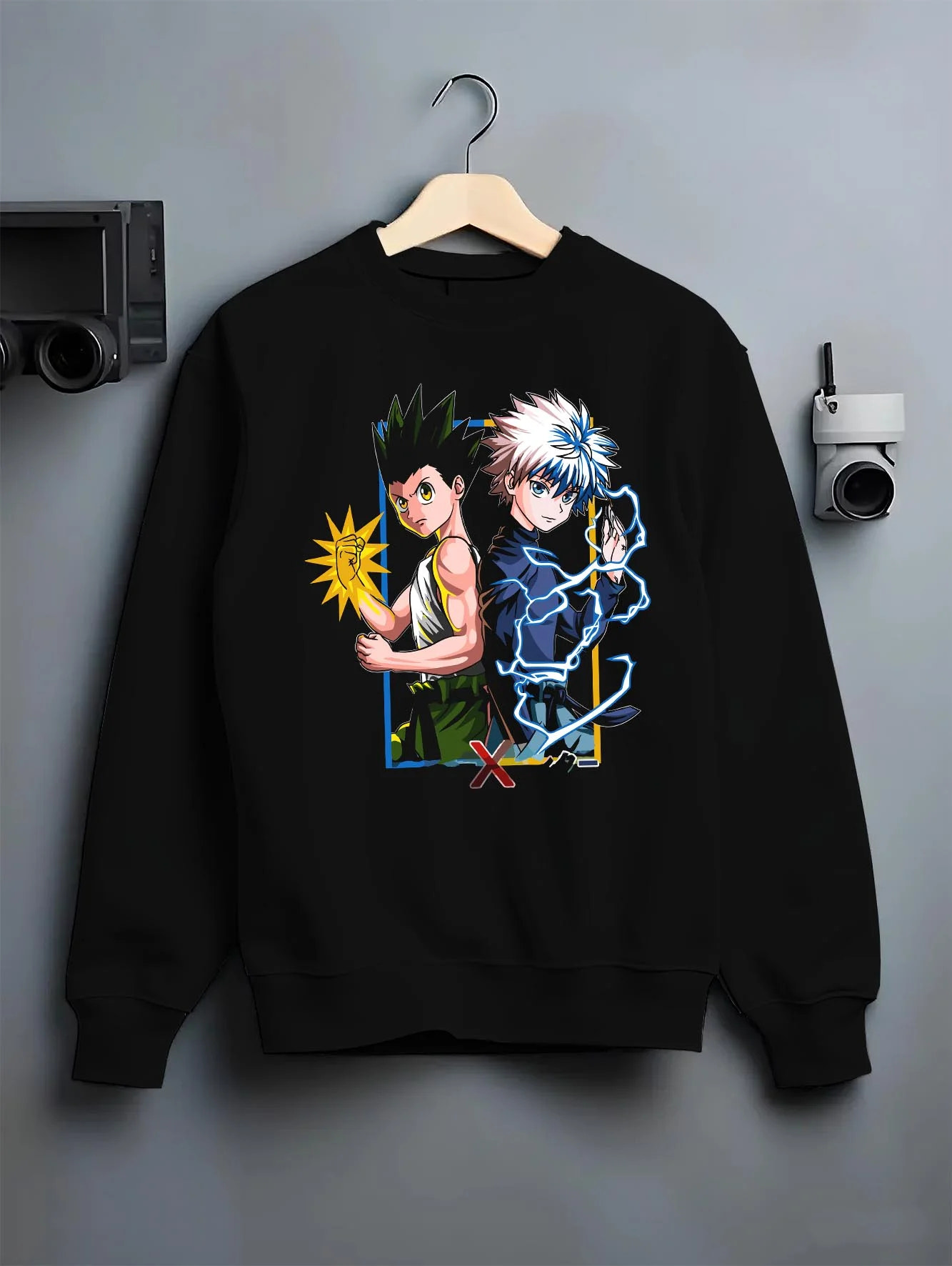 Black crewneck sweatshirt on hanger with Hunter x Hunter Hoodie Gon Freecss Determined Jumper graphic premium wear.