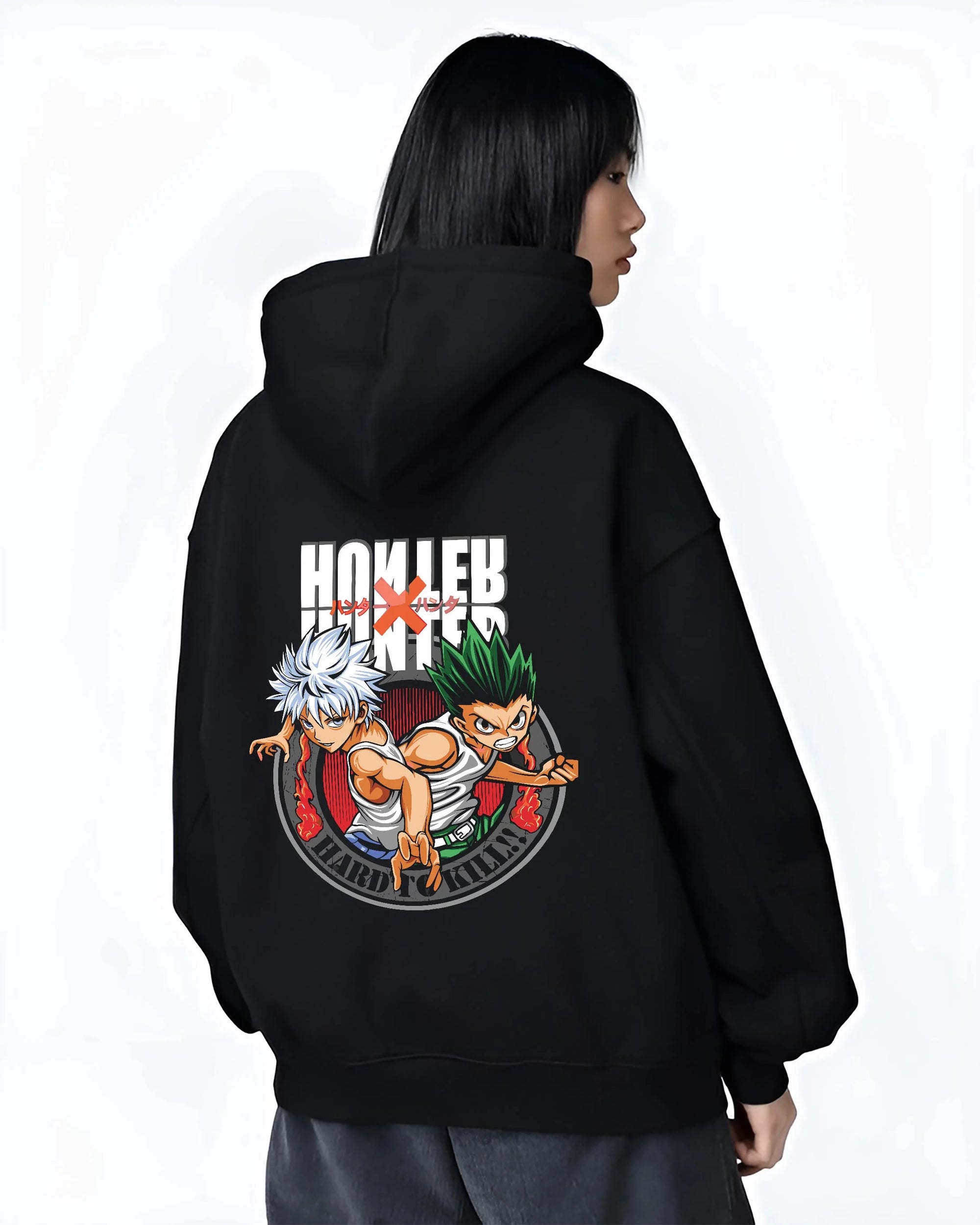 Black hoodie worn by female model, back view with Hunter x Hunter Hoodie Yorknew City Arc Jumper graphic bold anime graphic.