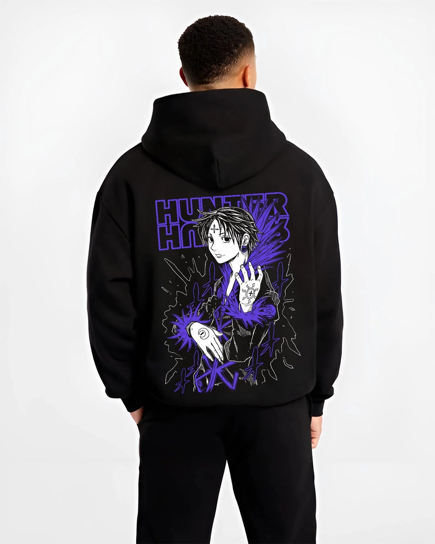 Black hoodie worn by male model, back view with Hunter x Hunter Hoodie Chrollo Hisoka Encounter Jumper graphic bold anime graphic.