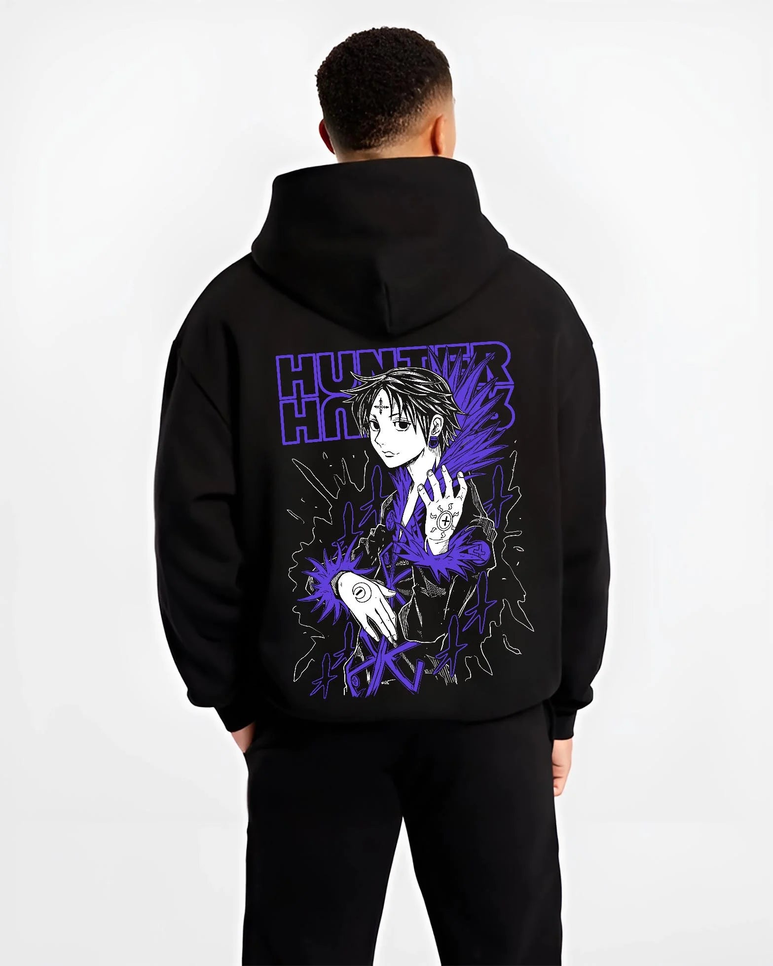 Black hoodie worn by male model, back view with Hunter x Hunter Hoodie Chrollo Hisoka Encounter Jumper graphic bold anime graphic.