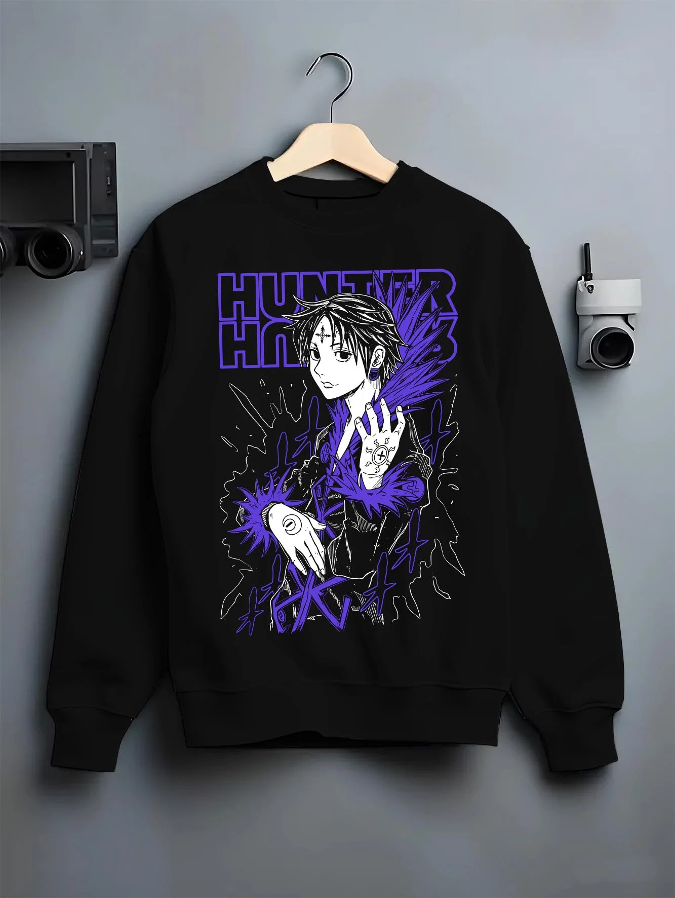 Black crewneck sweatshirt on hanger with Hunter x Hunter Hoodie Chrollo Hisoka Encounter Jumper graphic bold anime graphic.