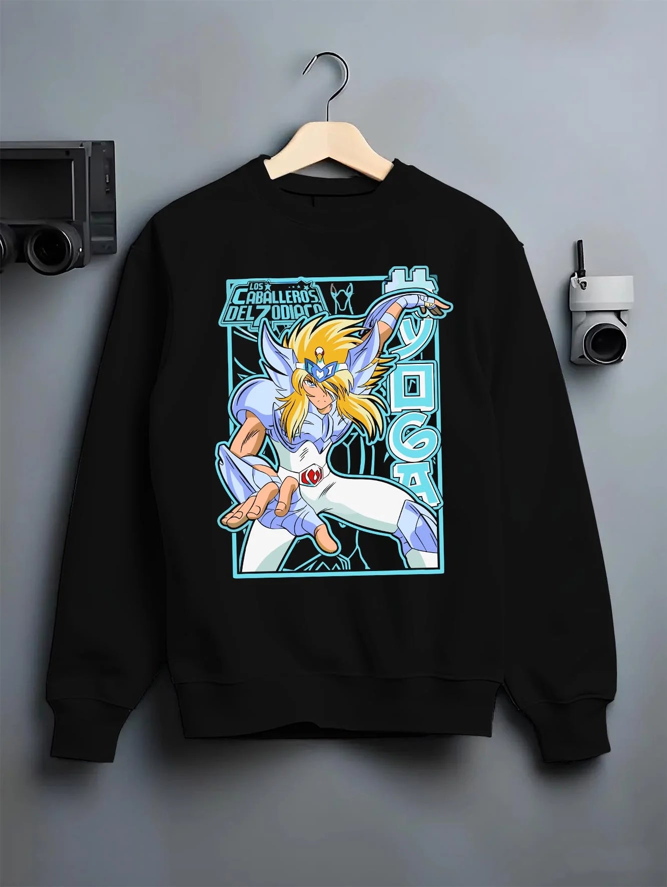 Black crewneck sweatshirt on hanger with Saint Seiya Hoodie Cygnus Hyoga Classic Pose Jumper graphic premium wear.