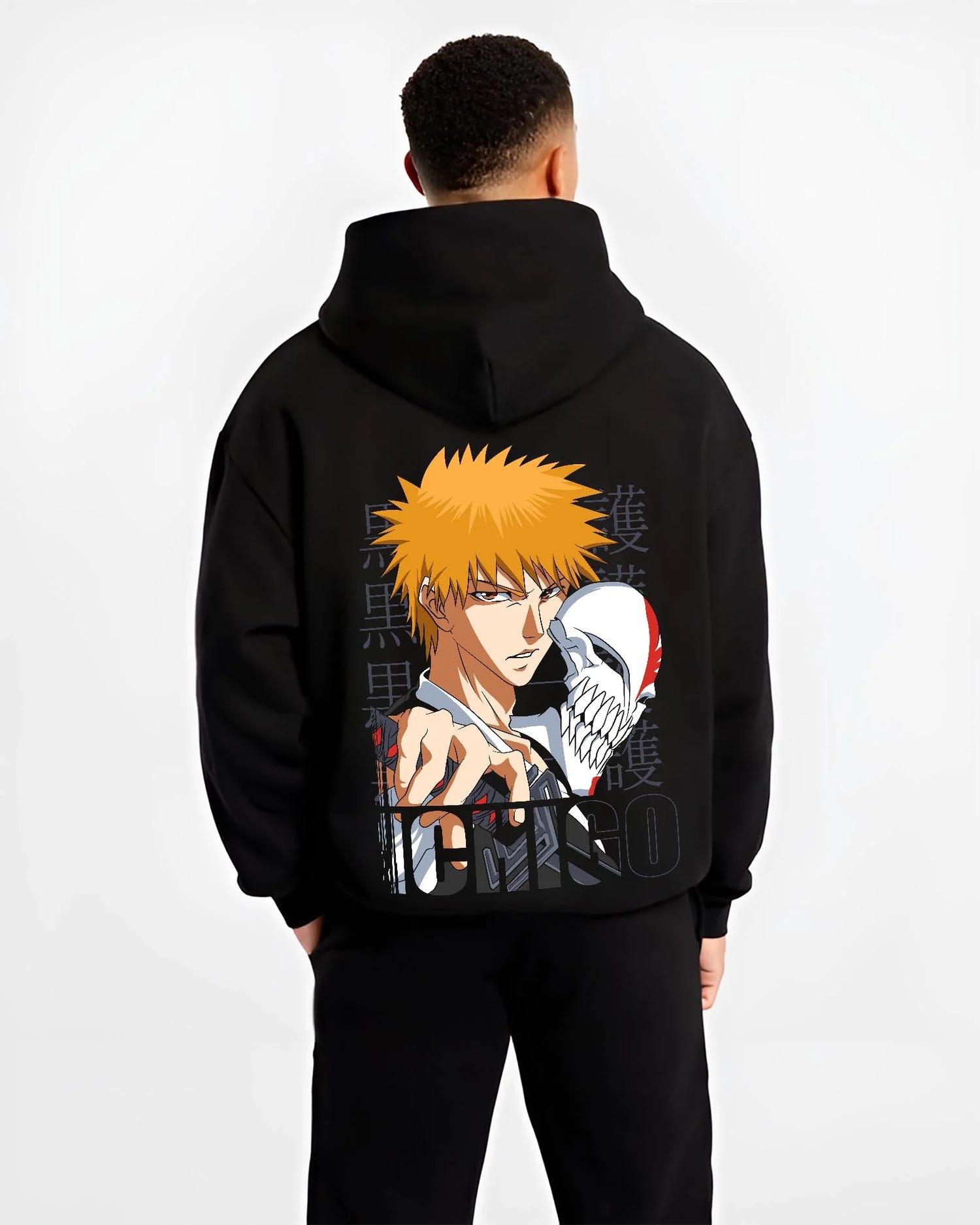 Black hoodie worn by male model, back view with Bleach Hoodie Ichigo Kurosaki Hollow Mask Jumper graphic streetwear graphic.