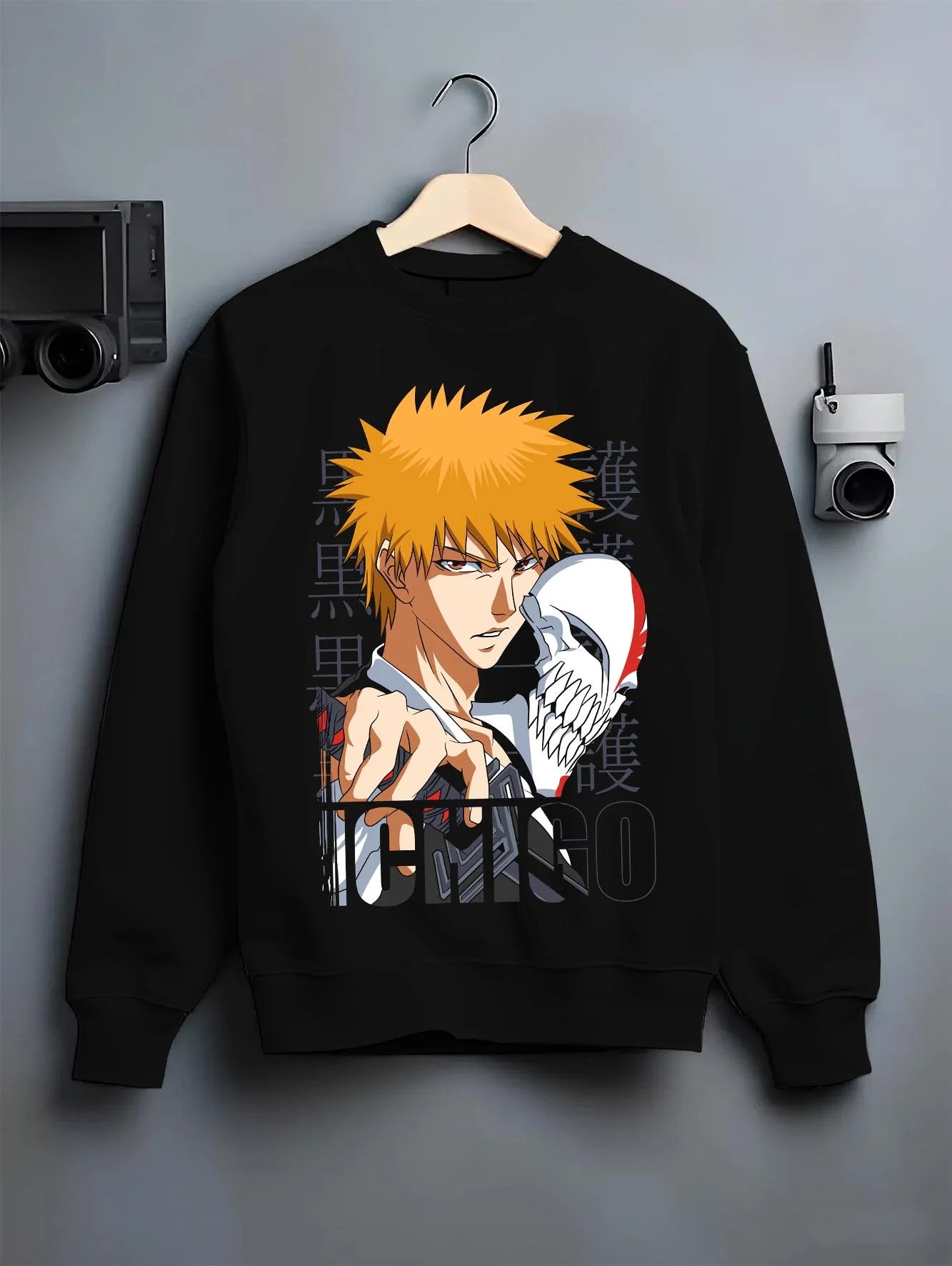 Black crewneck sweatshirt on hanger with Bleach Hoodie Ichigo Kurosaki Hollow Mask Jumper graphic streetwear graphic.