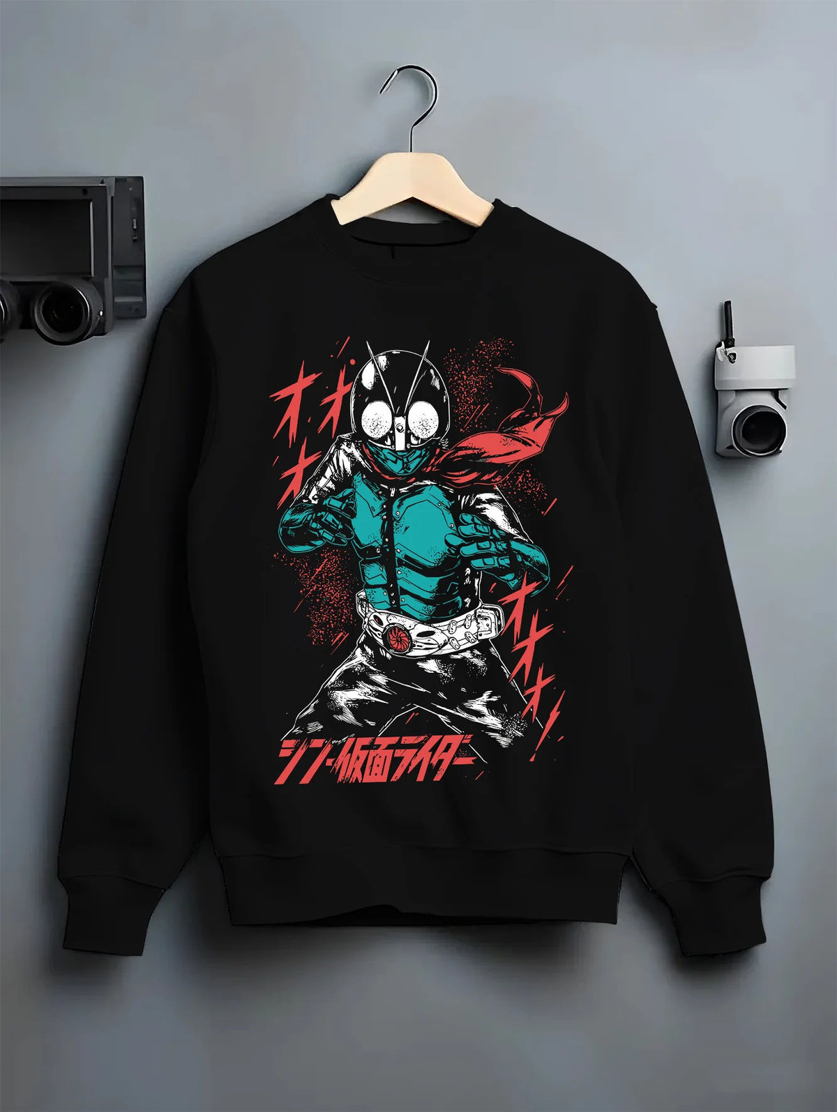 Black crewneck sweatshirt on hanger showing Kamen Rider Ichigo: green suit and red scarf