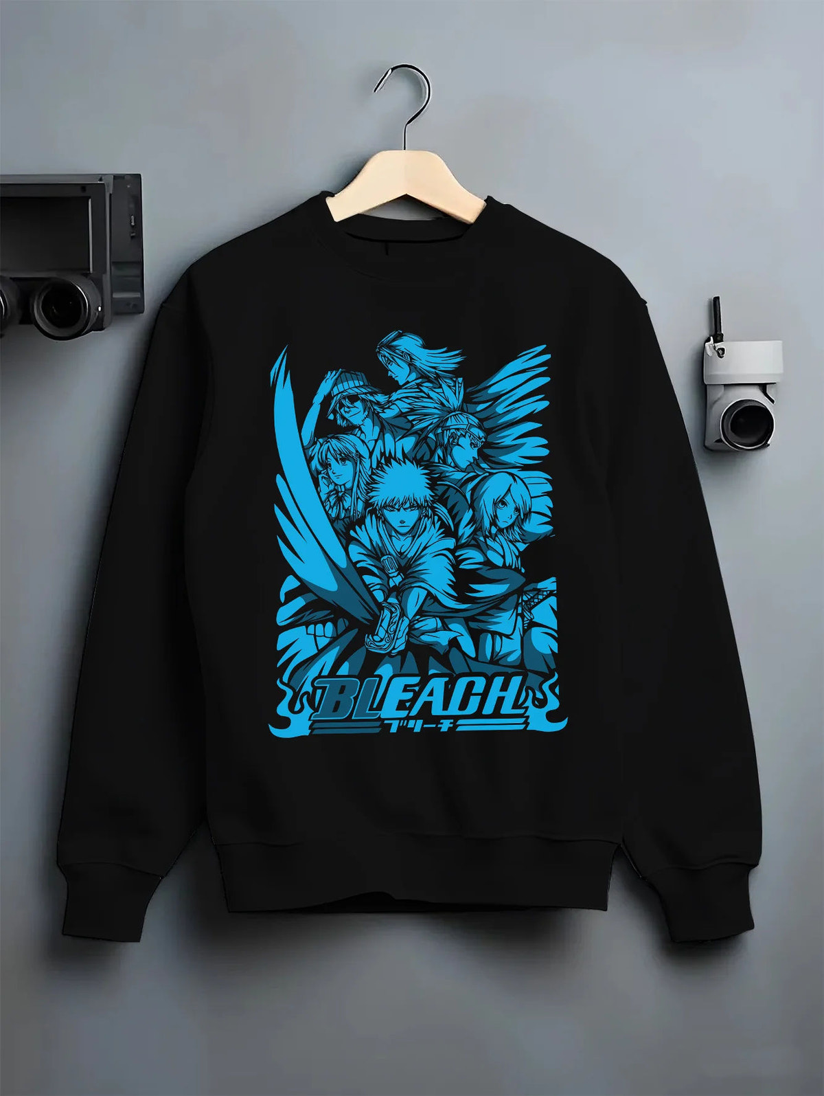Black crewneck sweatshirt on hanger with Ichigo/Rukia-themed Bleach manga collage illustrated back graphic