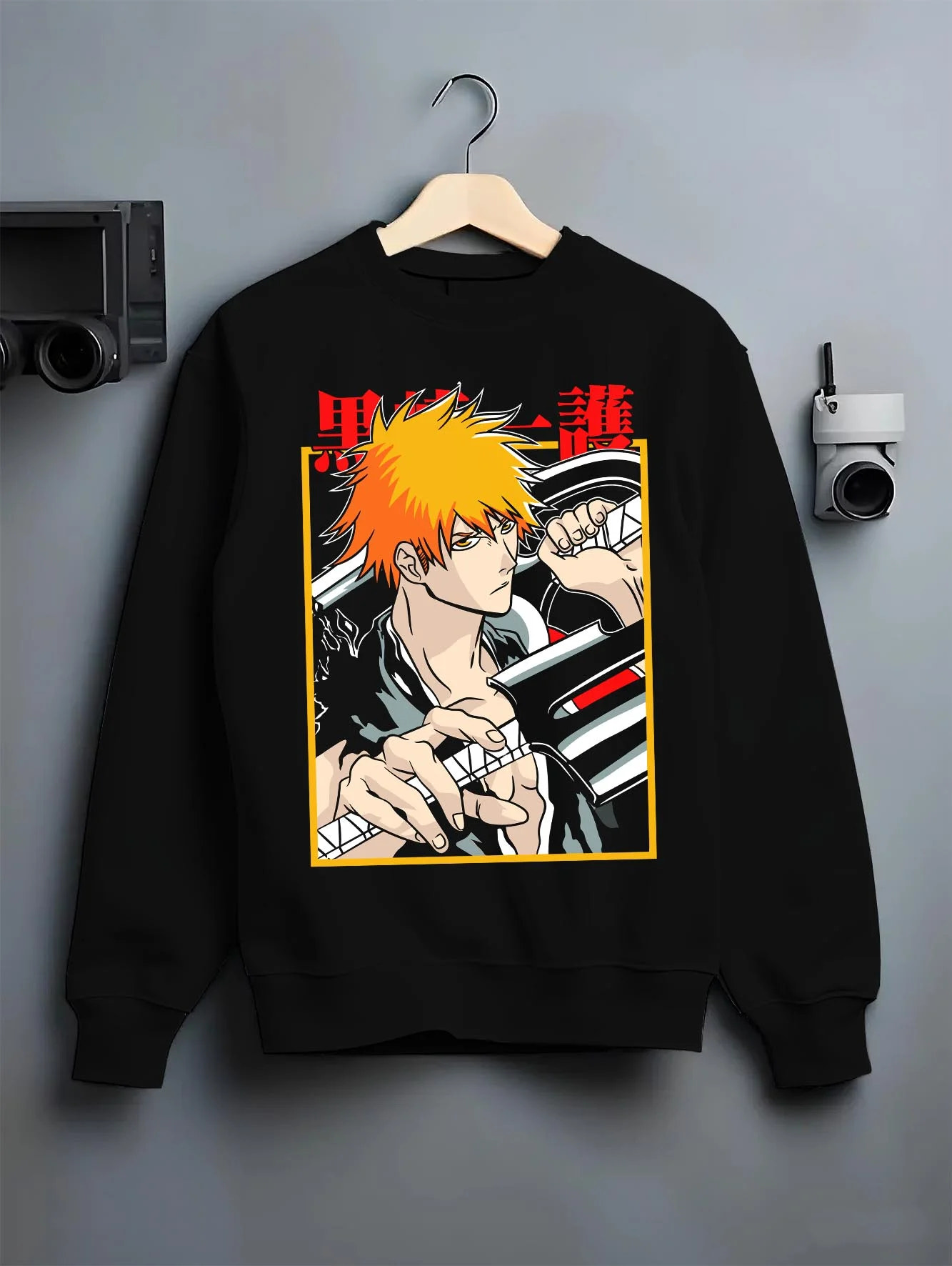 Black crewneck sweatshirt on hanger with Bleach Hoodie Ichigo Kurosaki Soul Reaper Jumper graphic streetwear graphic.