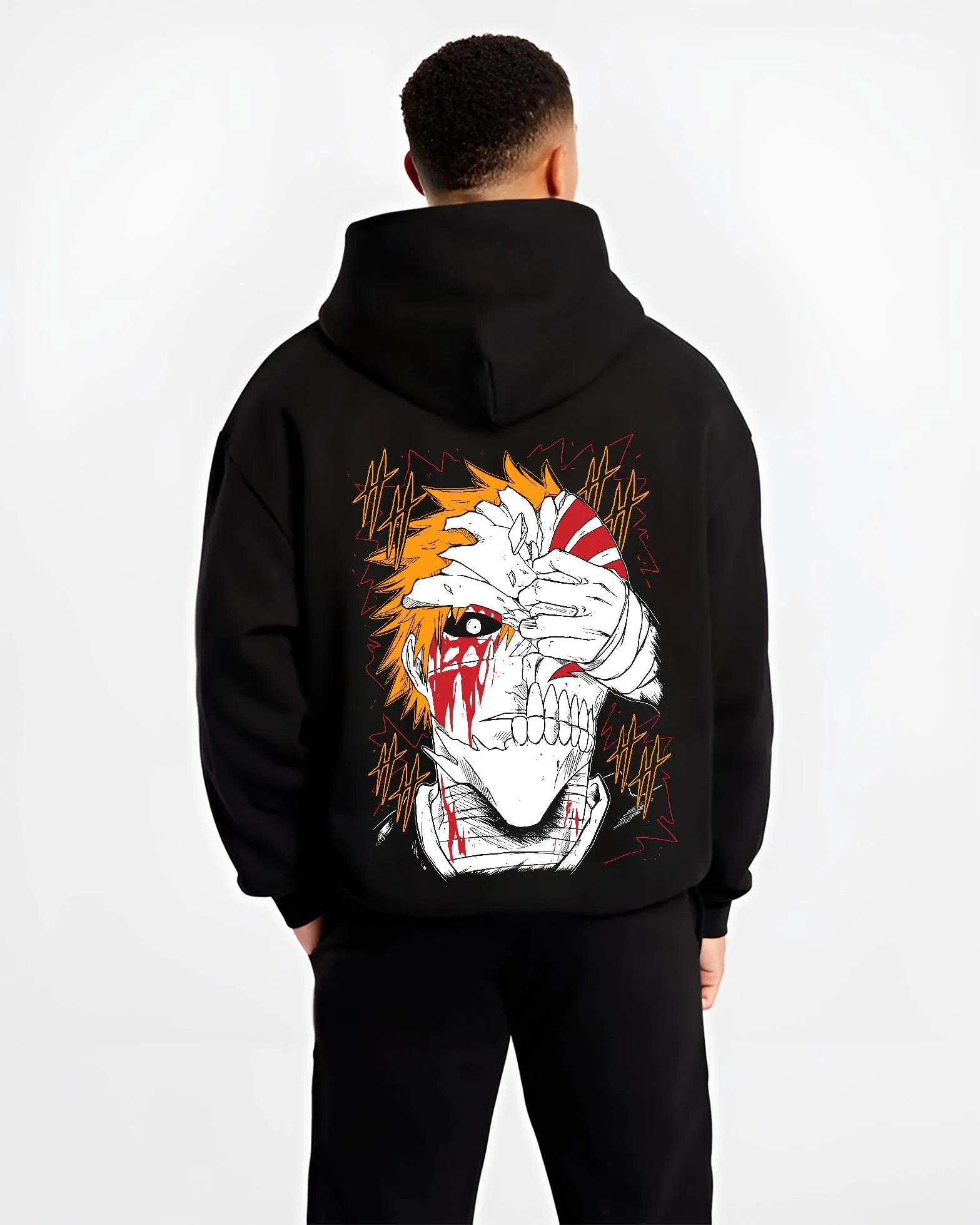 Black hoodie worn by male model, back view with Bleach Hoodie Ichigo Kurosaki Hollow Mask Jumper graphic streetwear graphic.