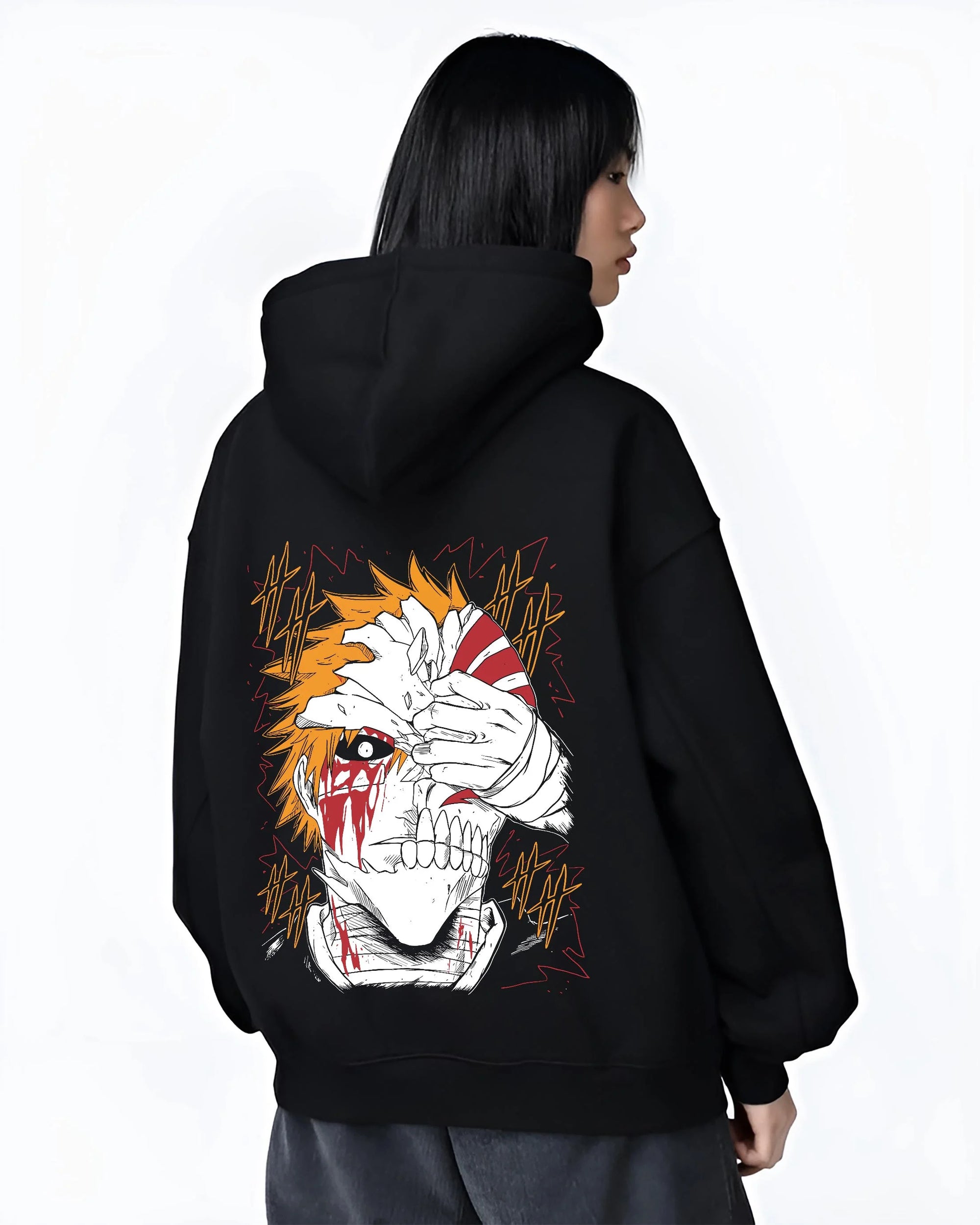 Black hoodie worn by female model, back view with Bleach Hoodie Ichigo Kurosaki Hollow Mask Jumper graphic premium wear.