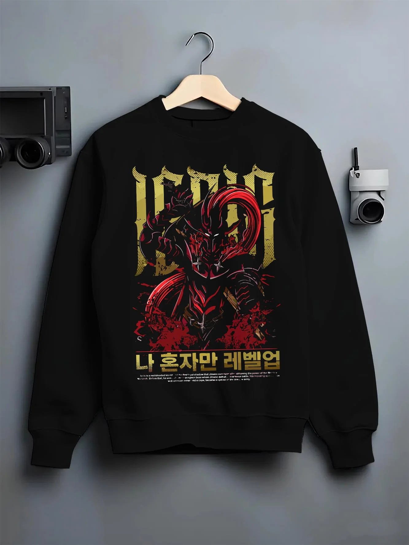 Black crewneck sweatshirt on hanger with Solo Leveling Hoodie Igris Commander Dark Jumper graphic bold anime graphic.