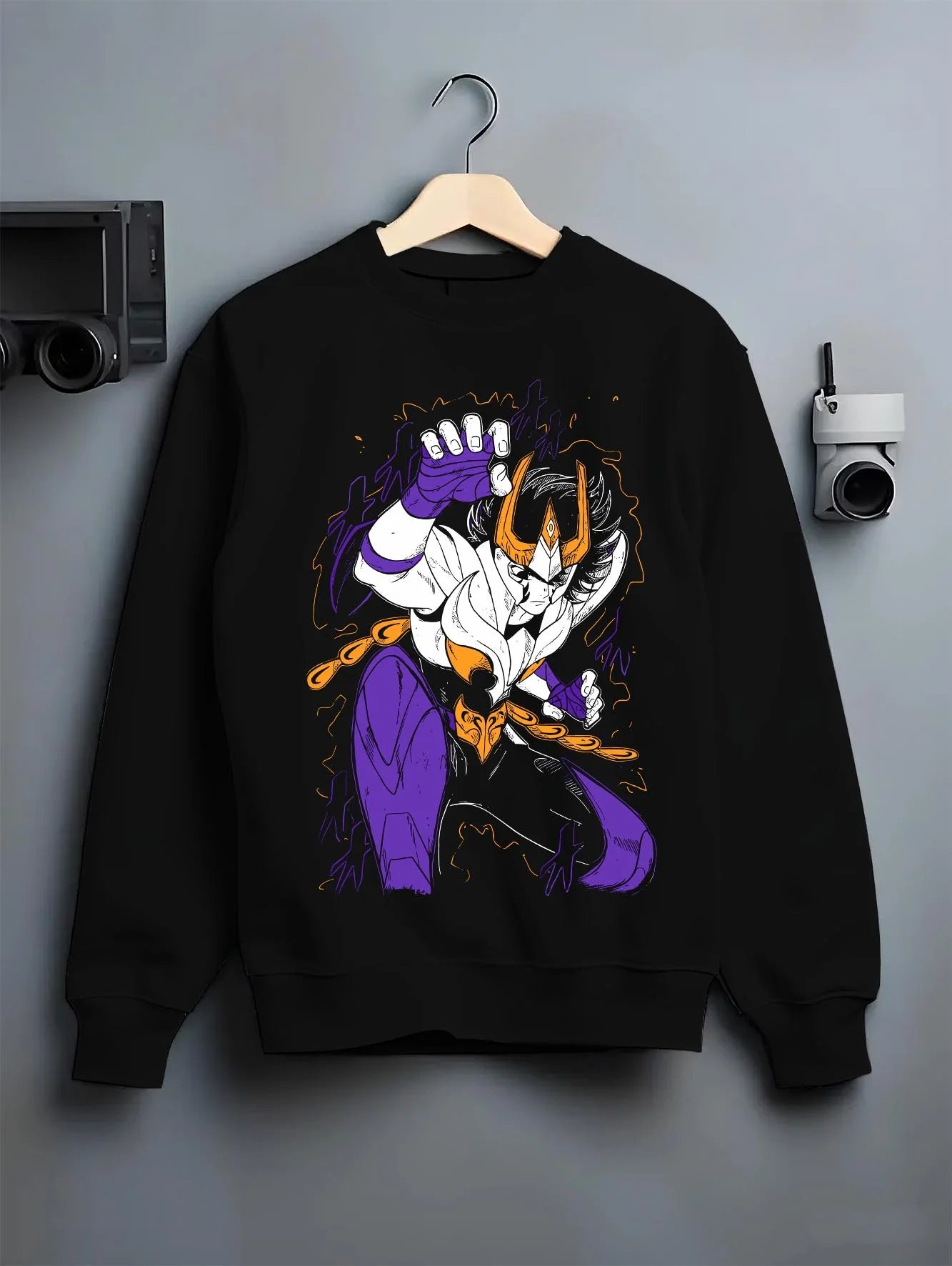 Black crewneck sweatshirt on hanger with Saint Seiya Hoodie Ikki Phoenix Burning Power Jumper graphic premium wear.