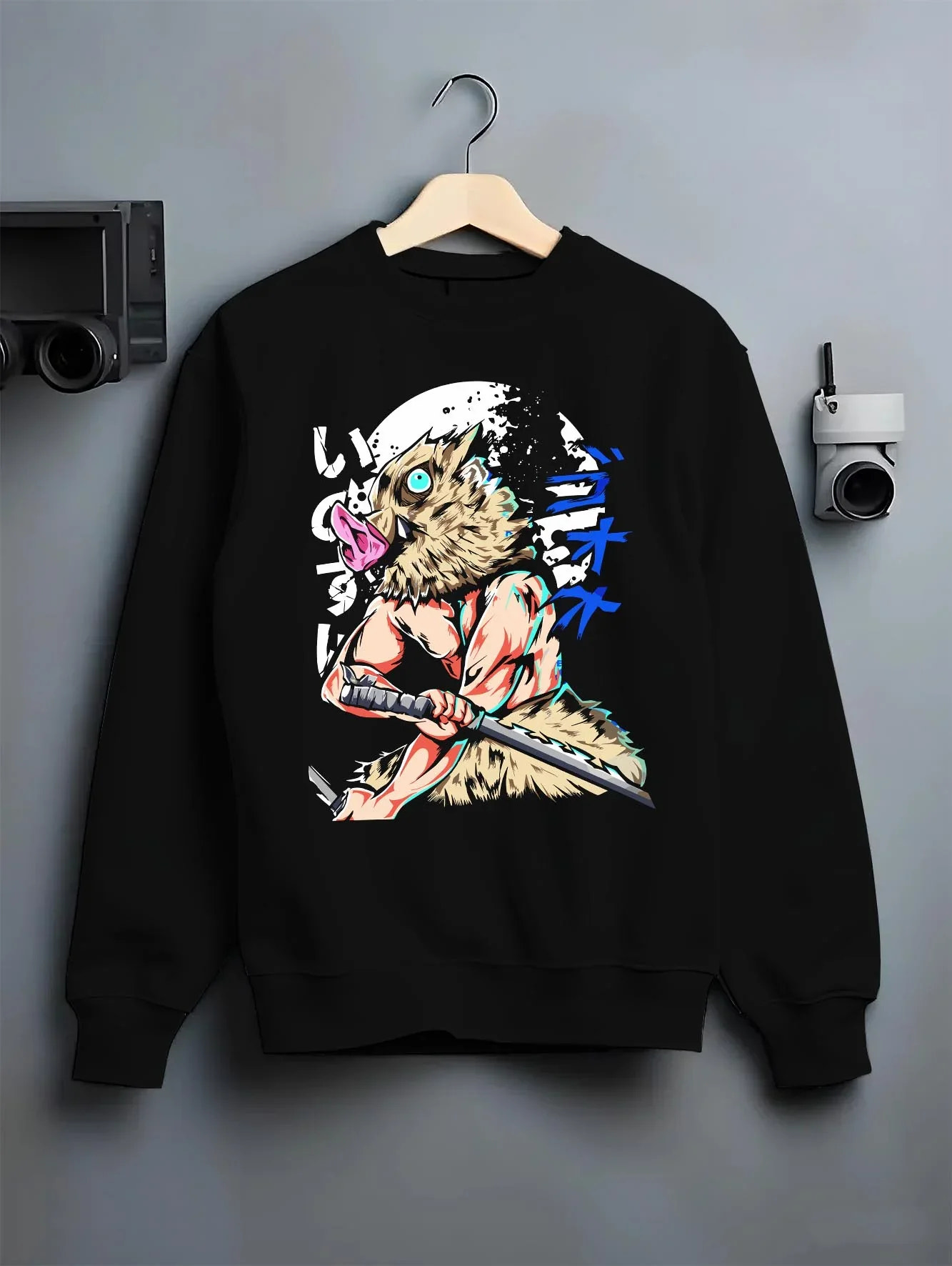Black crewneck sweatshirt on hanger with Demon Slayer Hoodie Inosuke Hashibira Twin Blades Jumper graphic streetwear graphic.