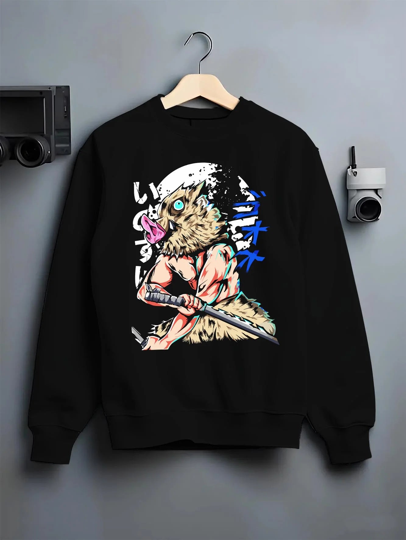 Black crewneck sweatshirt on hanger with Demon Slayer Hoodie Inosuke Hashibira Twin Blades Jumper graphic streetwear graphic.